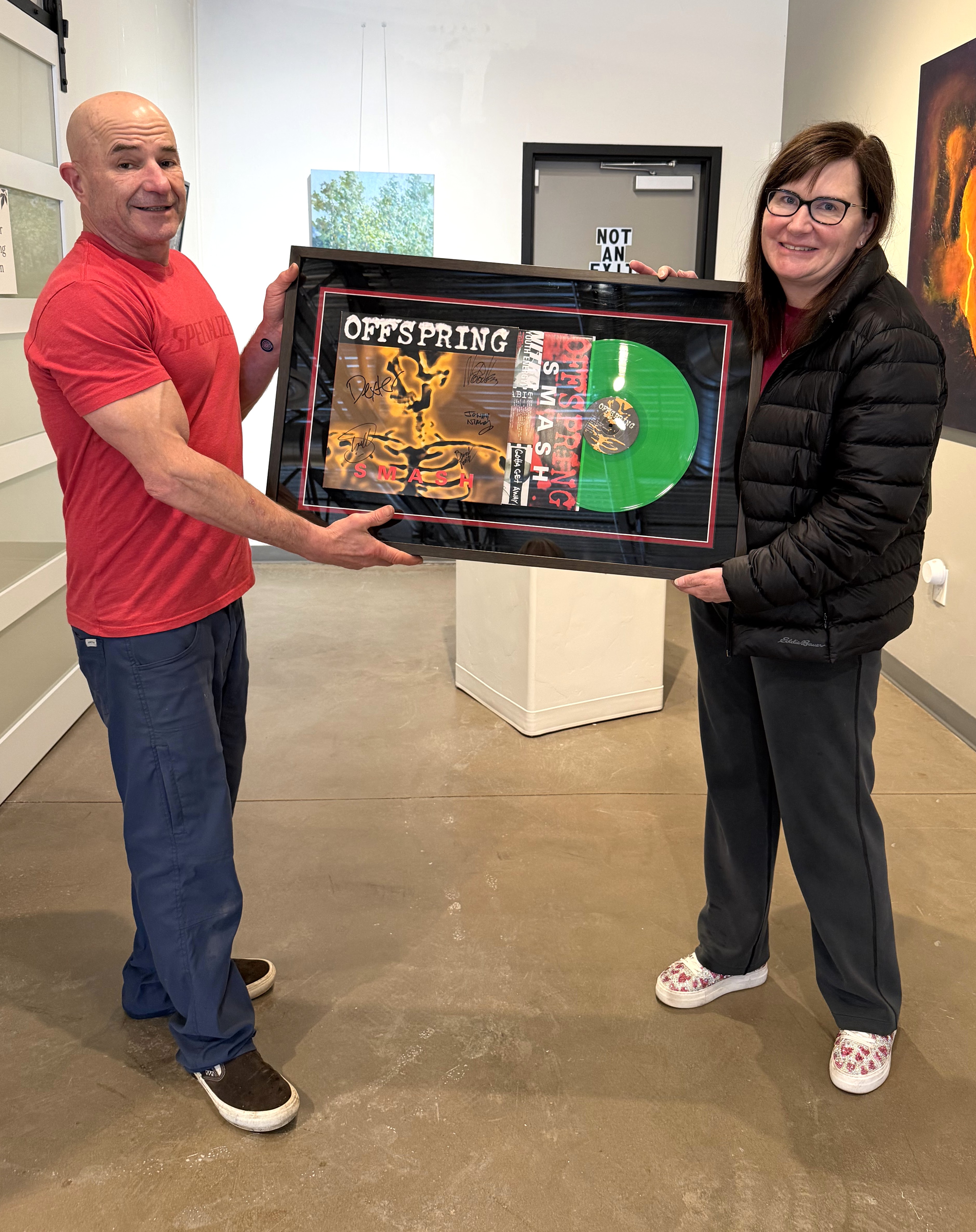custom framing for prints photography, personal artwork, and collectible pieces. leo with a happy custom framing customer with a collectible record. custom framing for prints photography, personal artwork, and collectible pieces. leo with a happy custom framing customer with a collectible record.