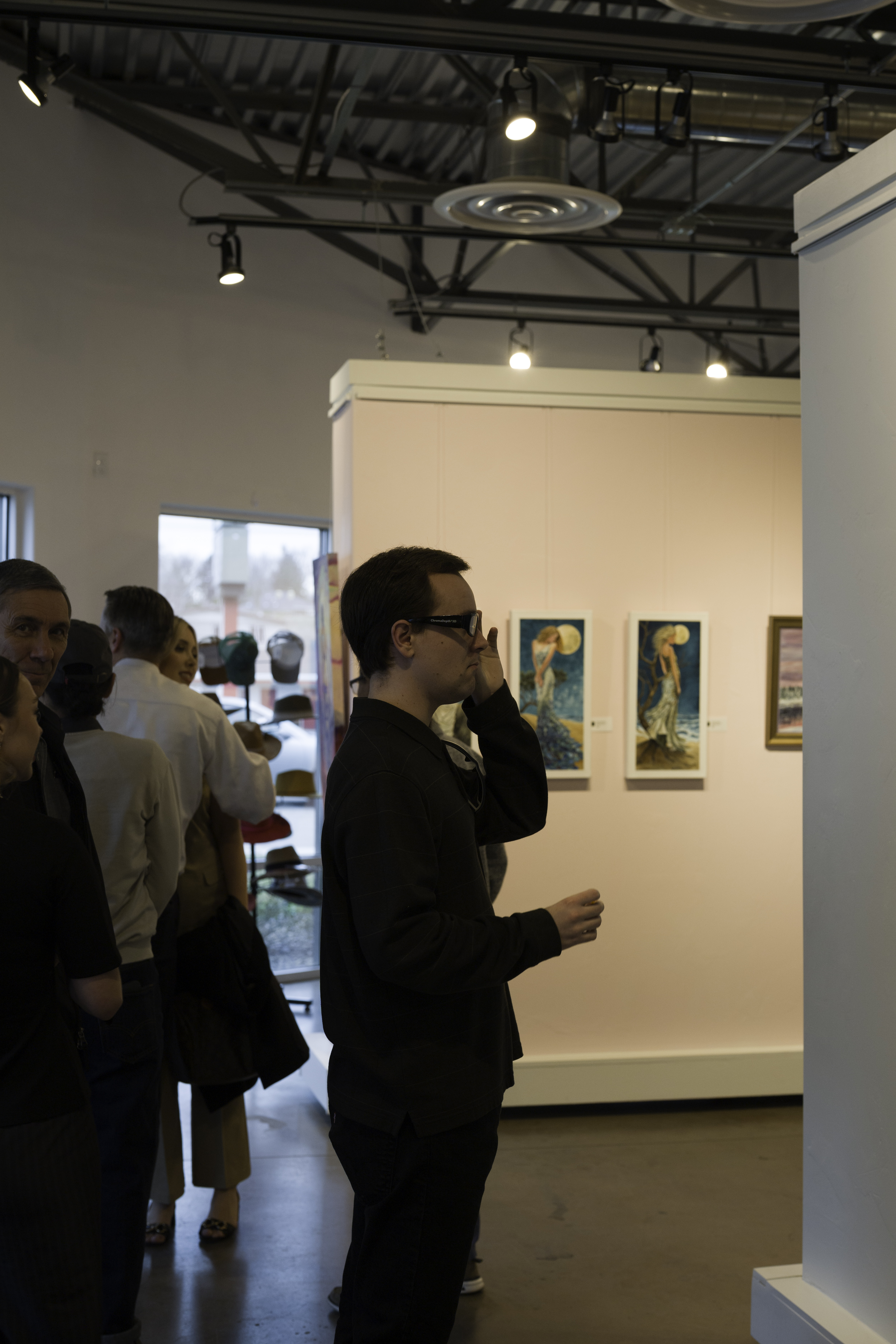 visitor viewing art at create gallery and frames