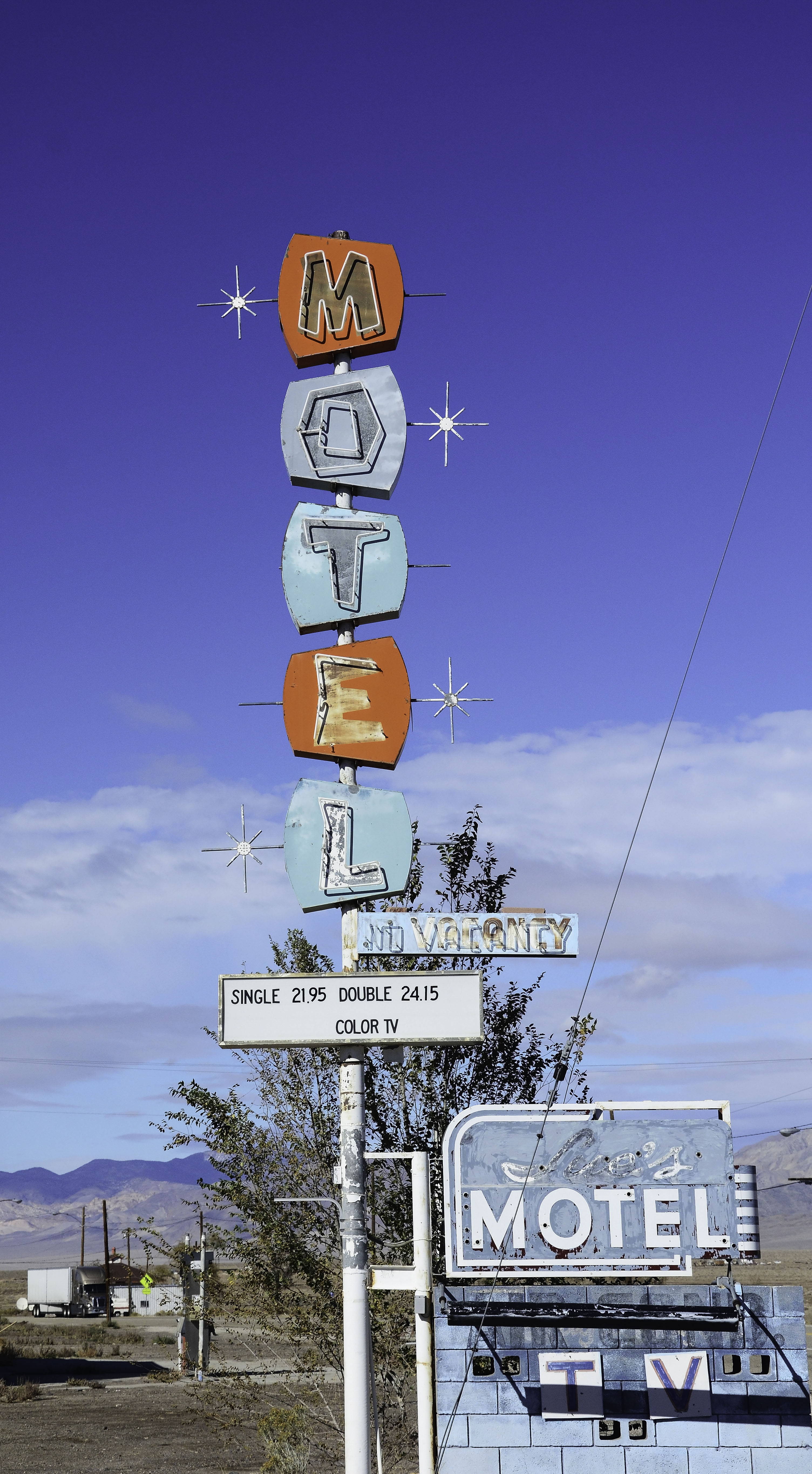michael logullo art piece motel on display at create gallery and frames in garden city idaho