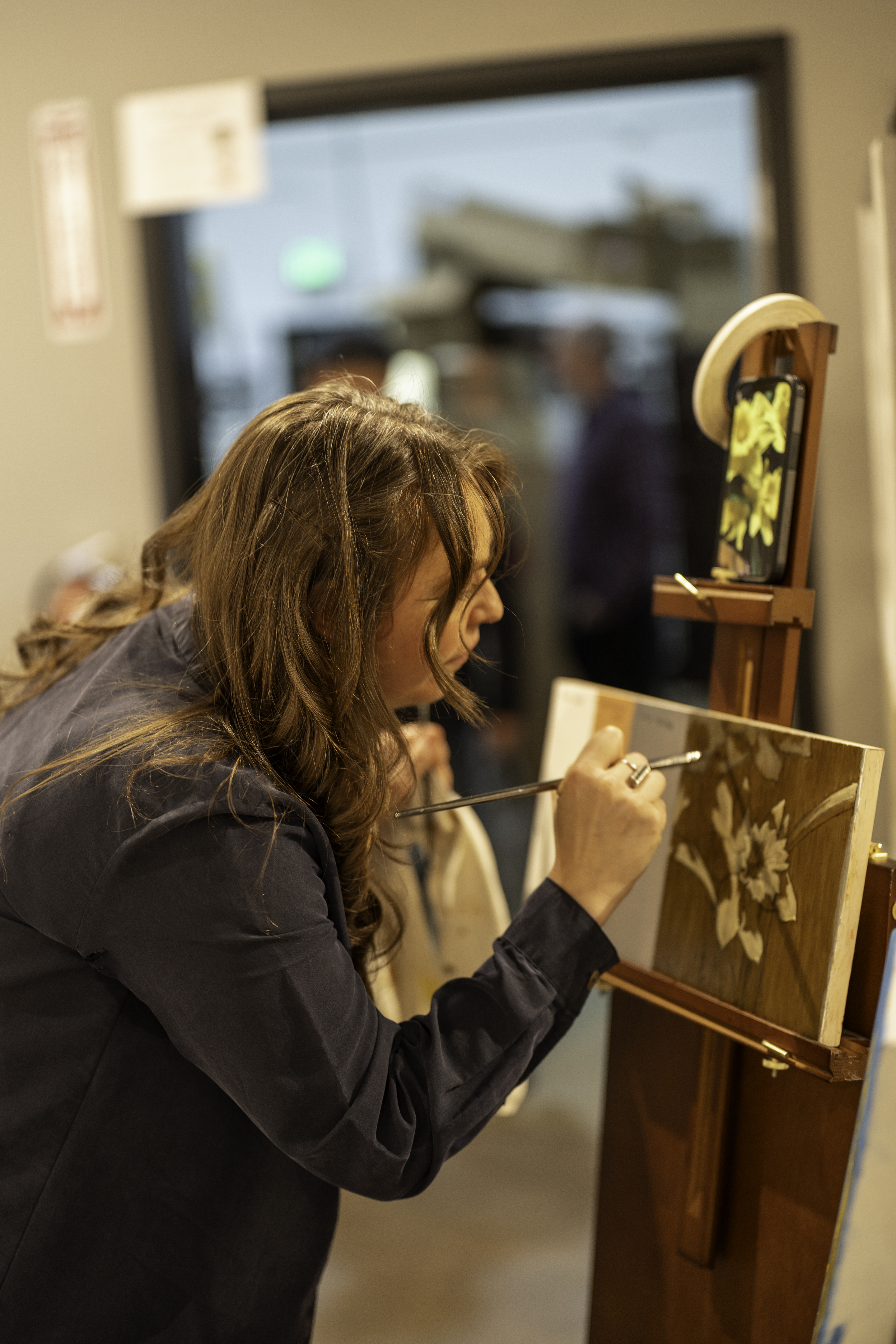 “artist creating original artwork in studio with visible texture and detail”