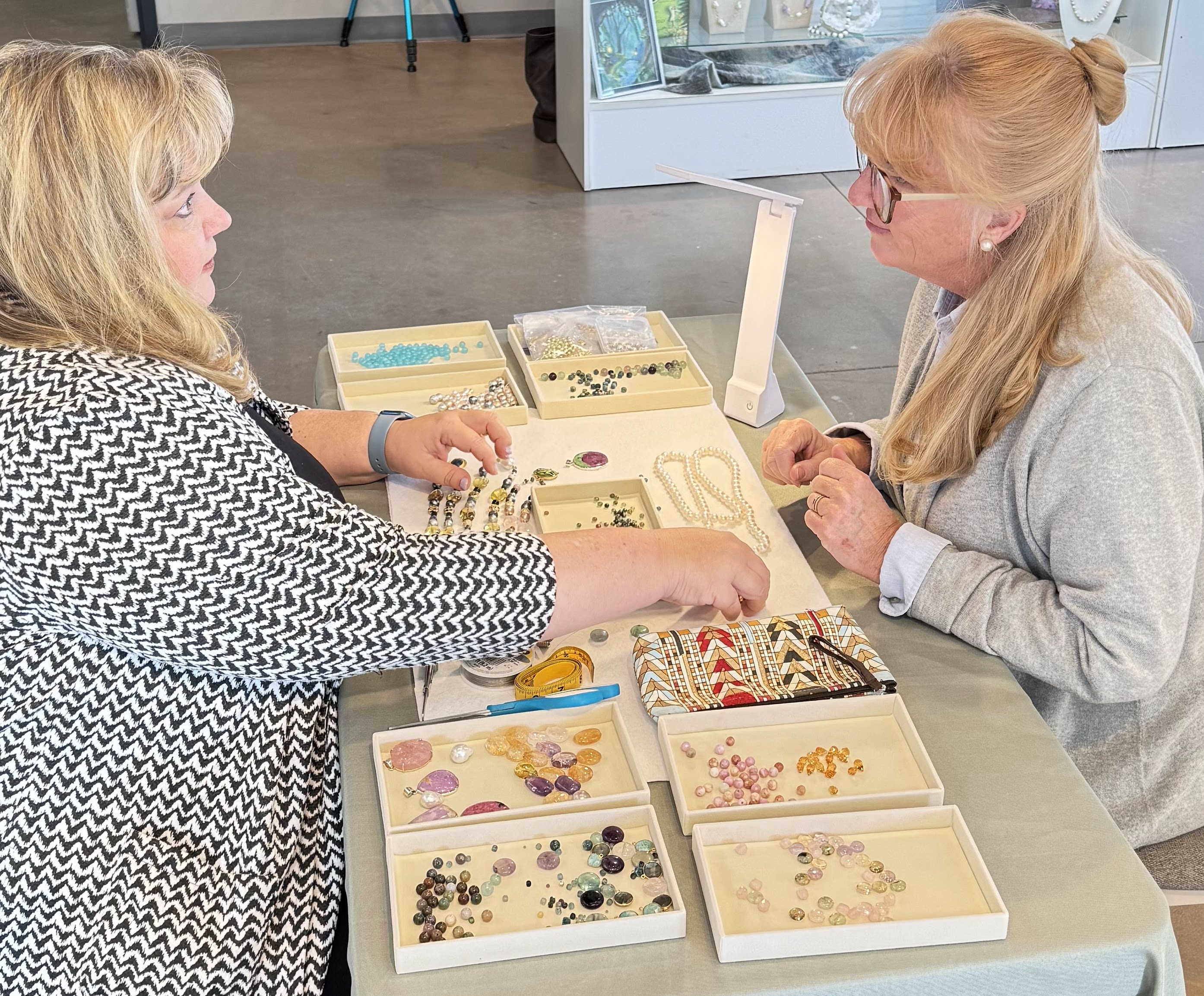 Elizabeth van tassel with treasured gems jewelry doing a consultation with a customer 
