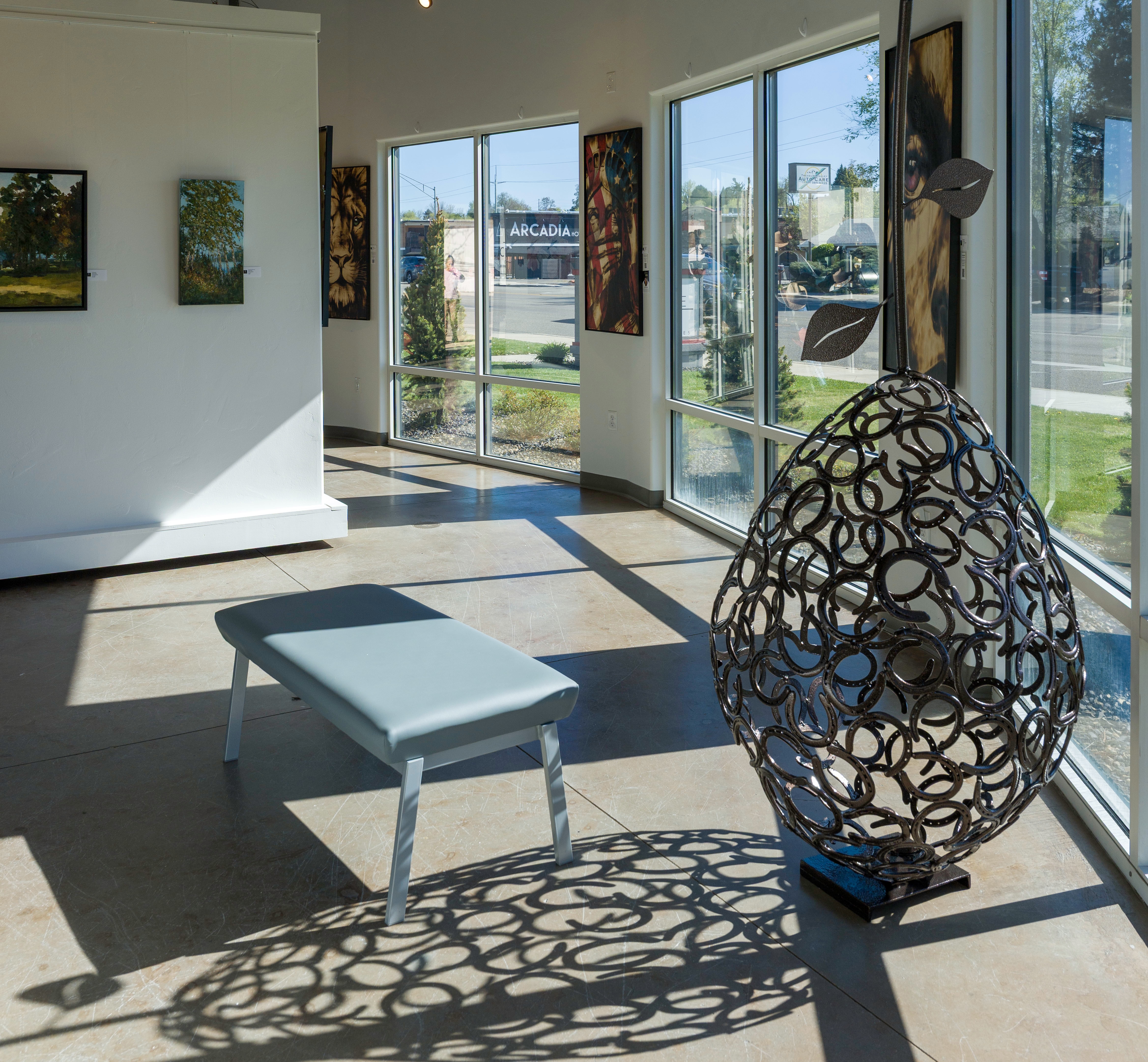 fine art gallery interior with textured artwork on display at Create Gallery and Frames Garden City Idaho