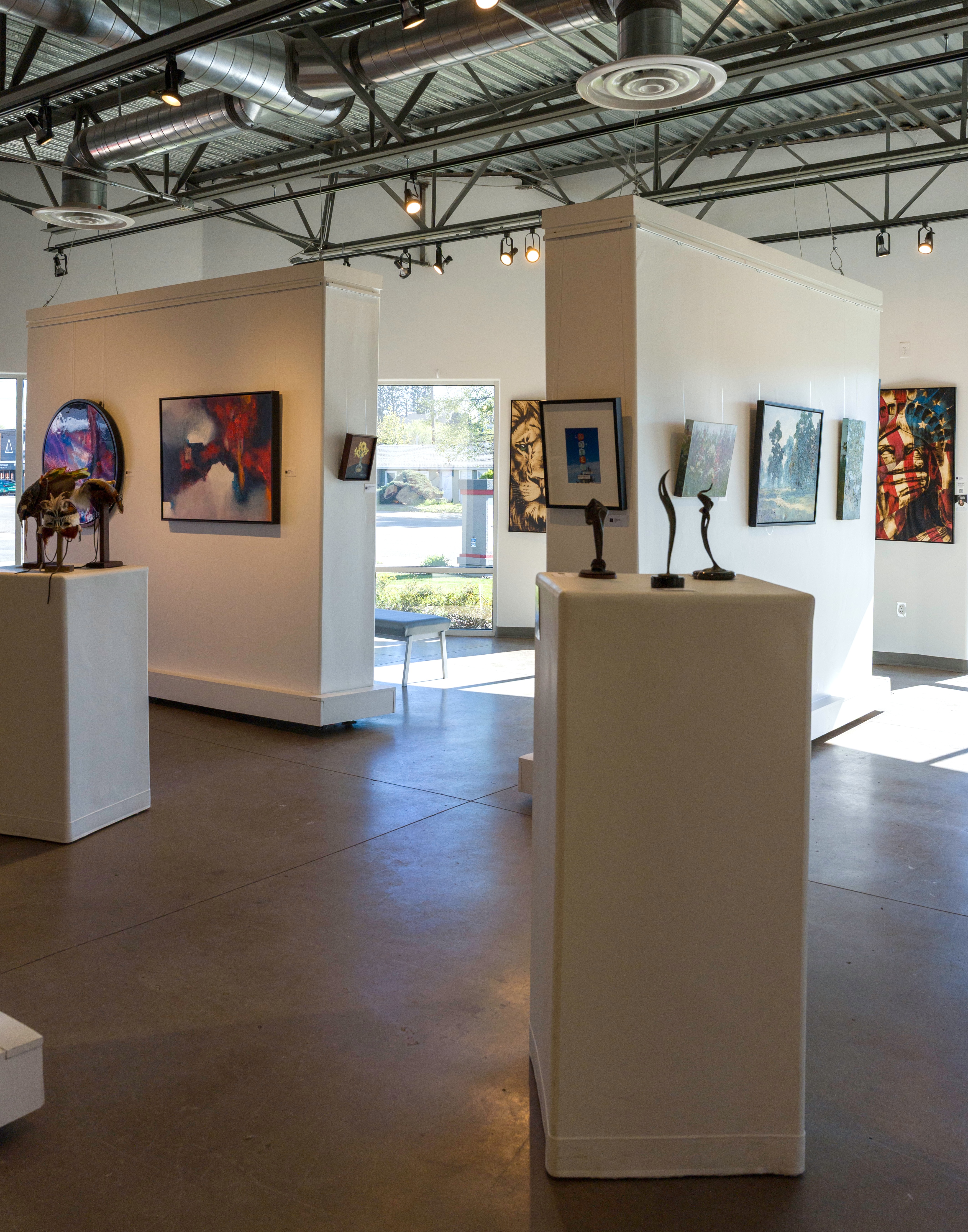 interior of Create Gallery and Frames art gallery in Garden City Idaho near Boise with original artwork on display