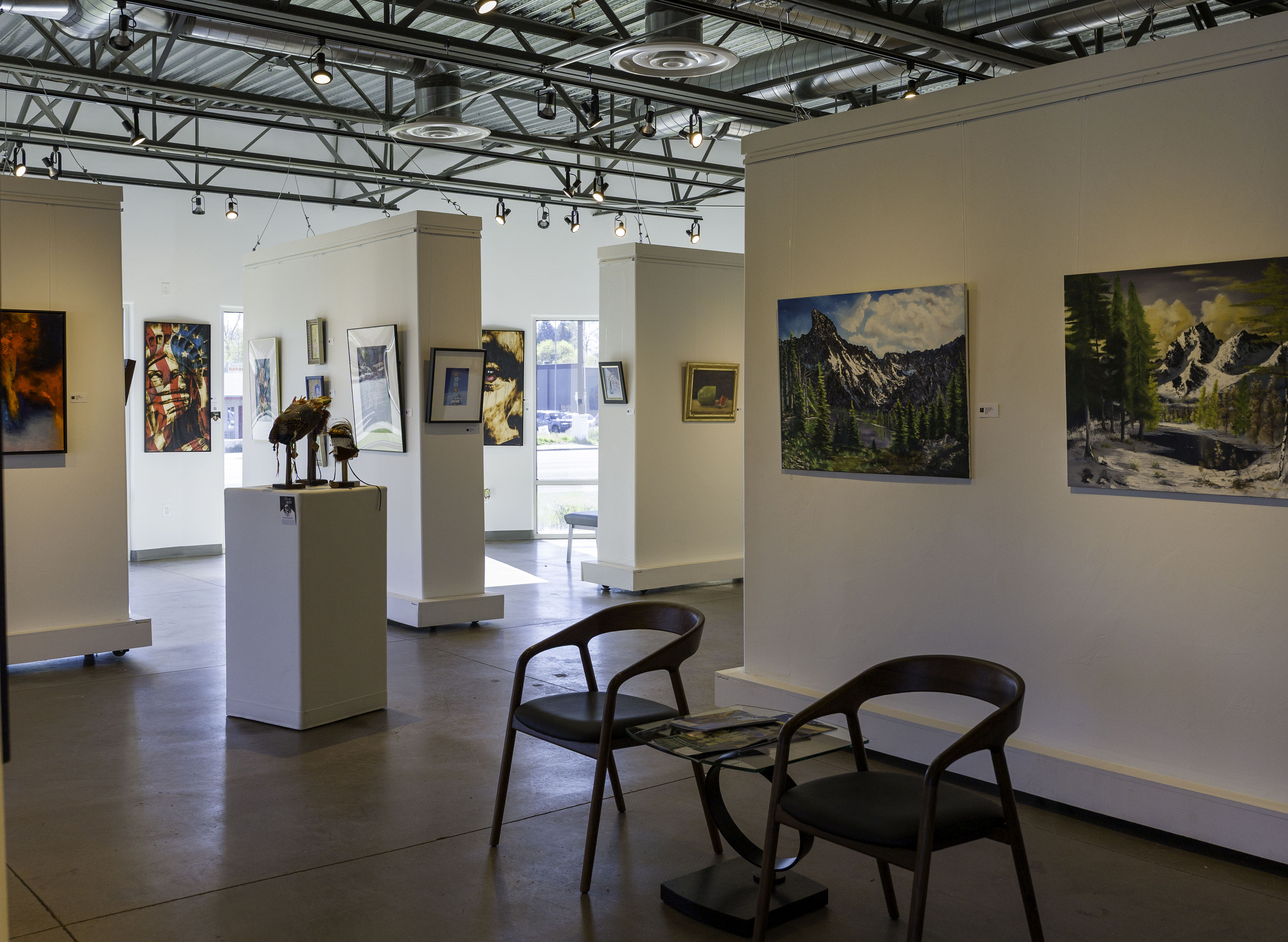 fine art gallery walls with paintings sculptures and mixed media at Create Gallery and Frames Garden City Idaho