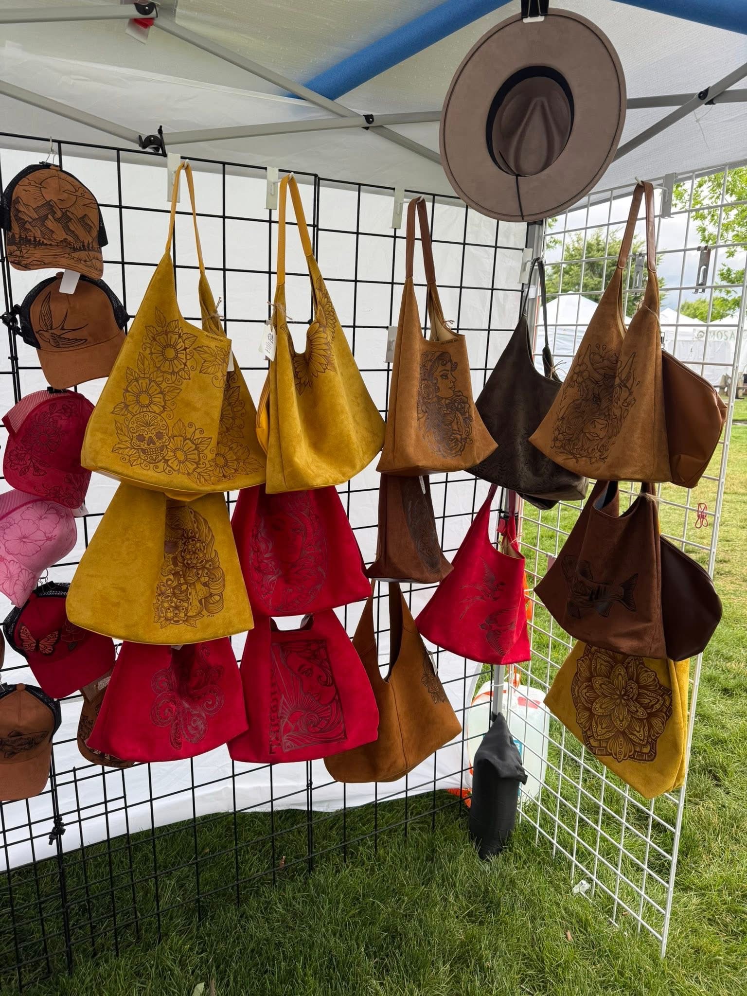 Original wod-burned purses displayed by jennifer parks at the Meridian Fine Art Festival.