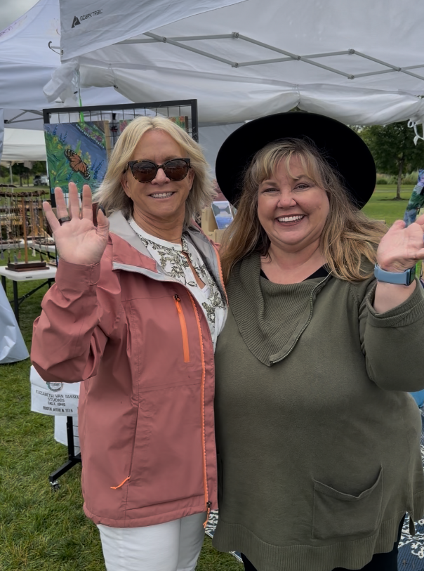 create gallery and frames owner joan edwards with artist elizabeth van tassel at meridian fine art festival