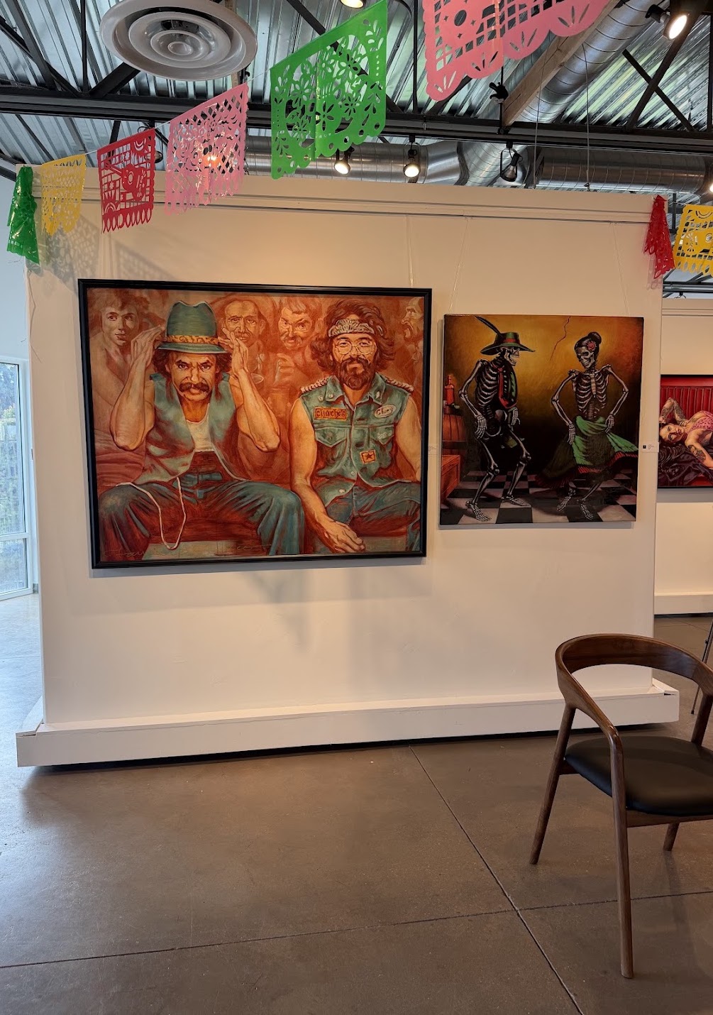 Día de los Muertos exhibition at Create Gallery and Frames featuring colorful decorations, framed paintings, and festive displays. Día de los Muertos exhibition at Create Gallery and Frames featuring colorful decorations, framed paintings, and festive displays.