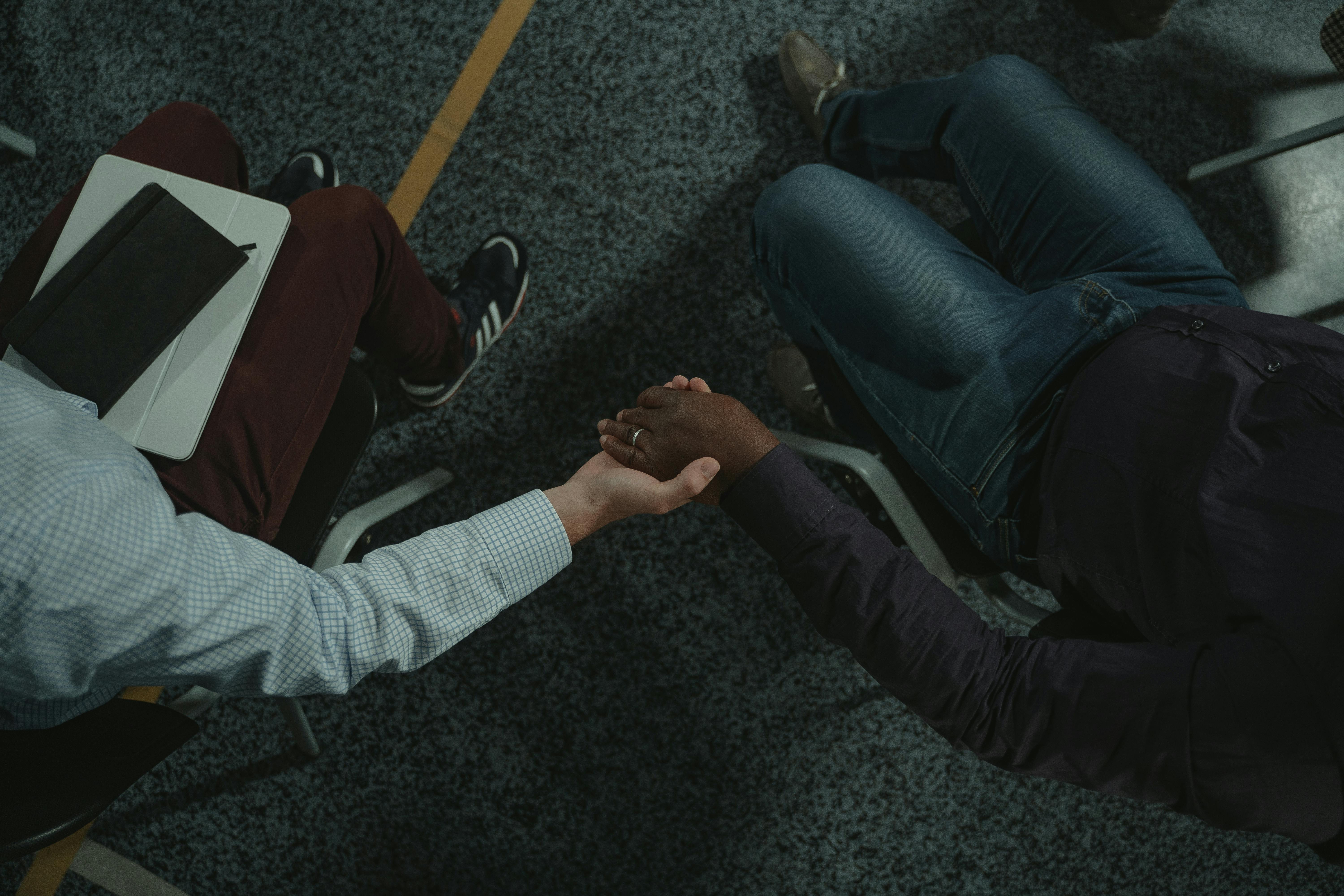 A health coaching session, two people in a supportive, professional conversation