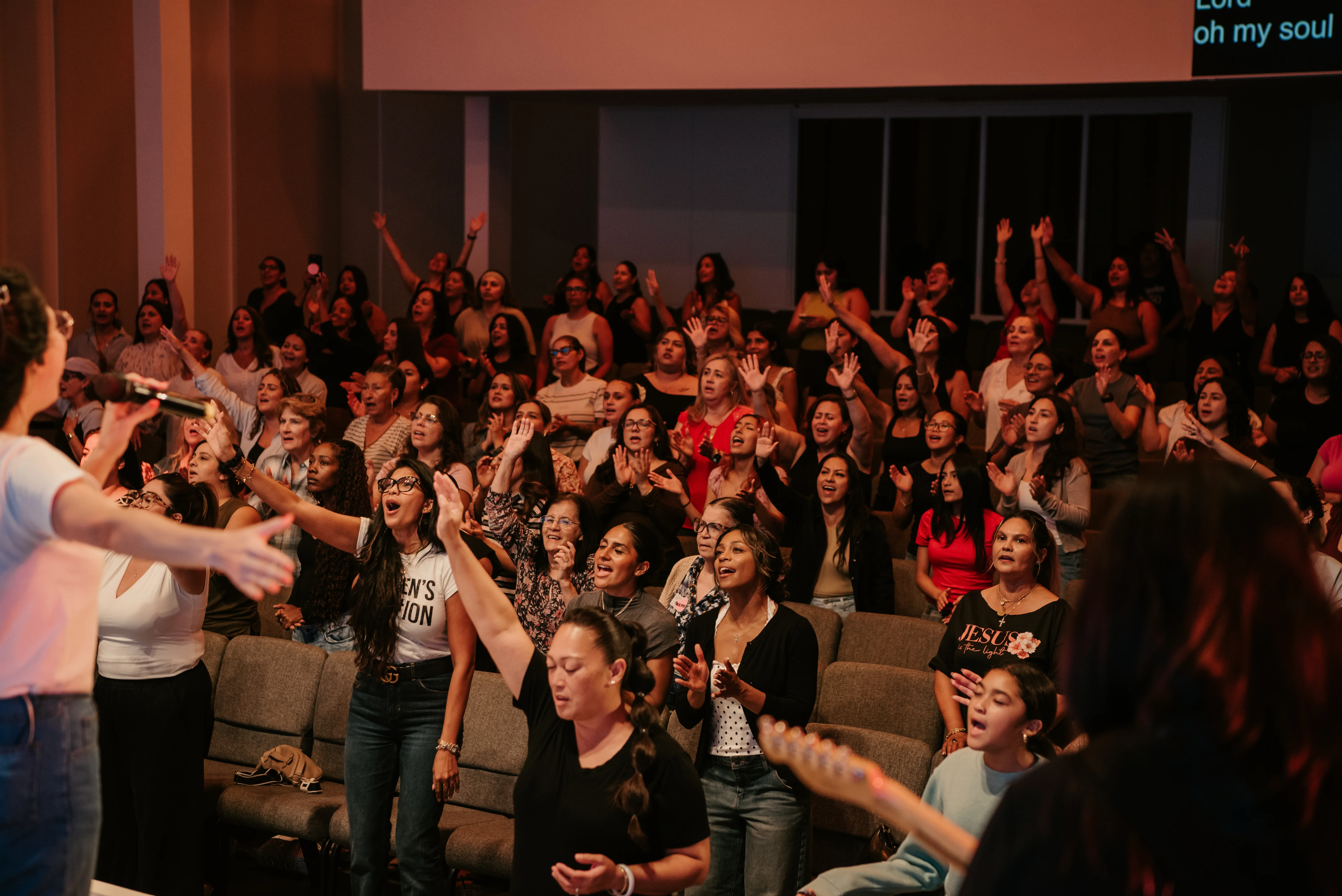 Women worshipping during a Radiant Girls gathering
