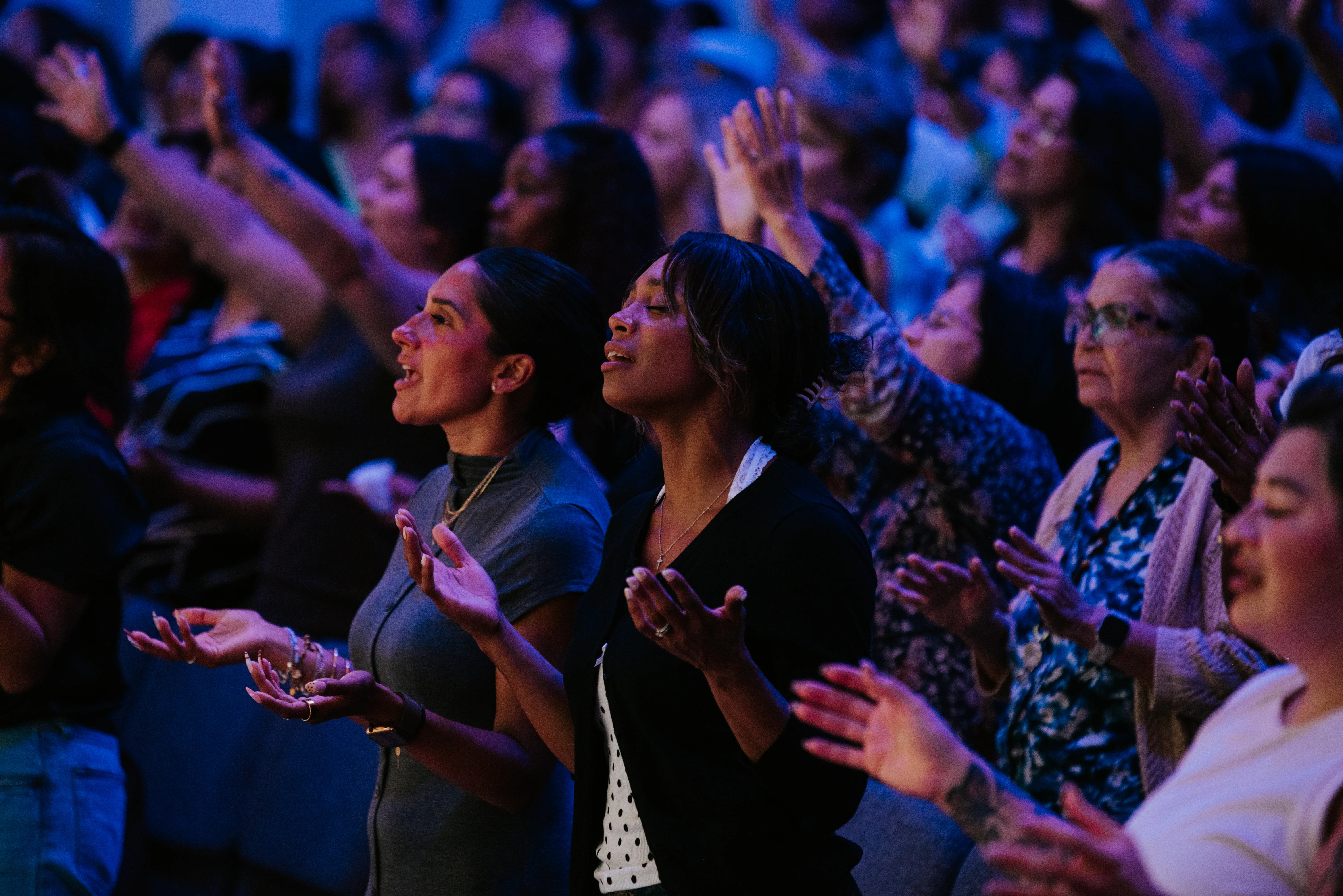 Women worshipping together