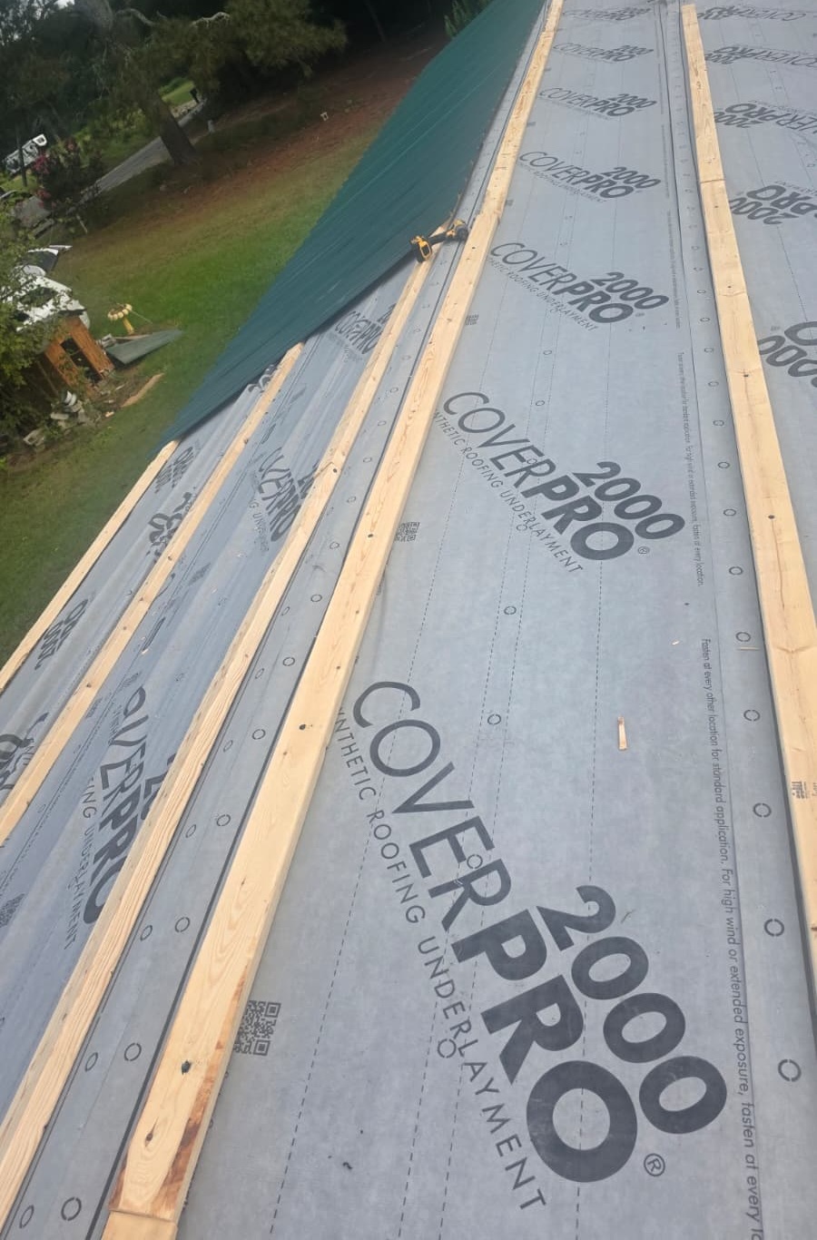 Roofing underlayment installation in progress