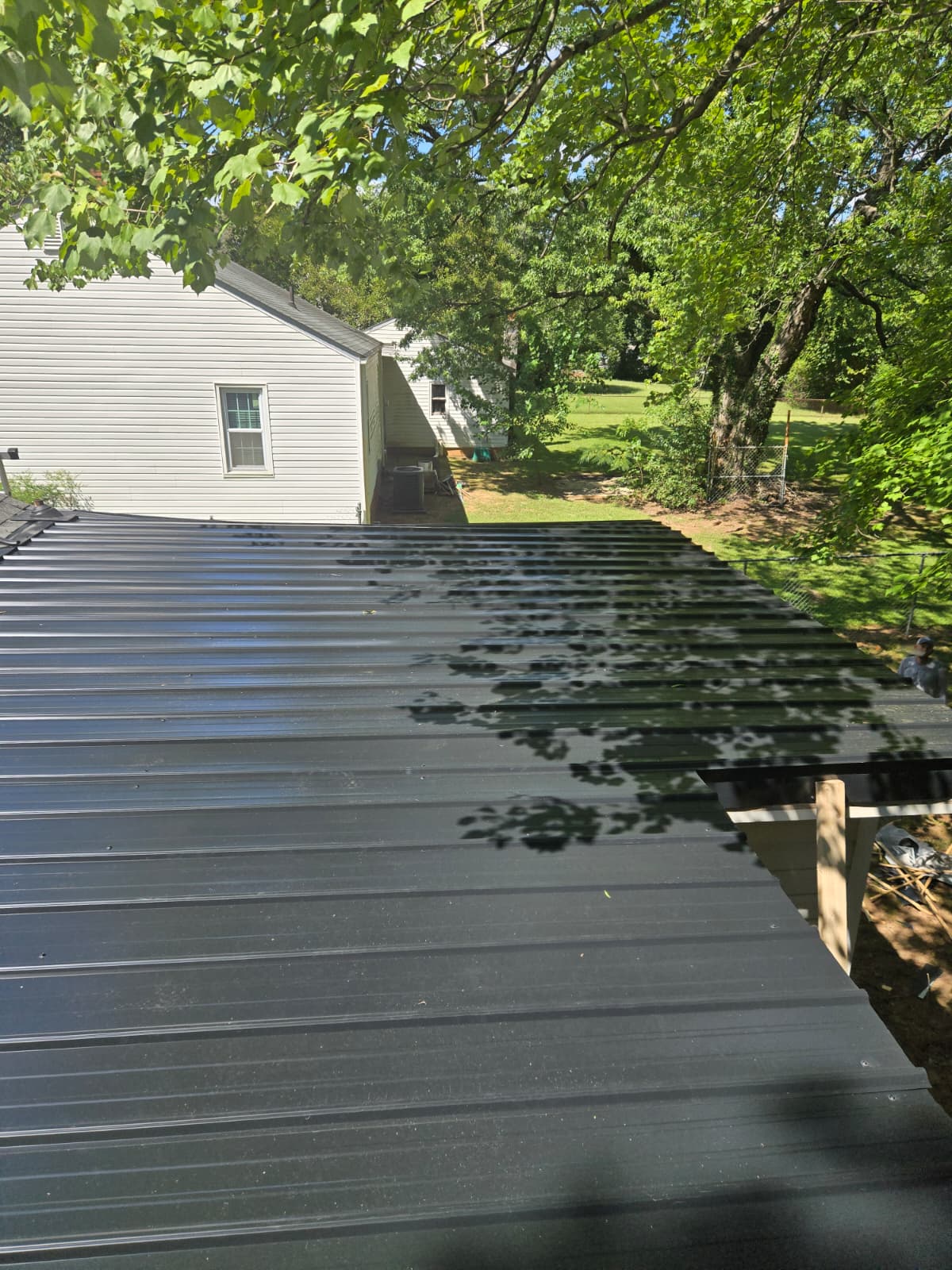 New metal roof meeting old shingle roof