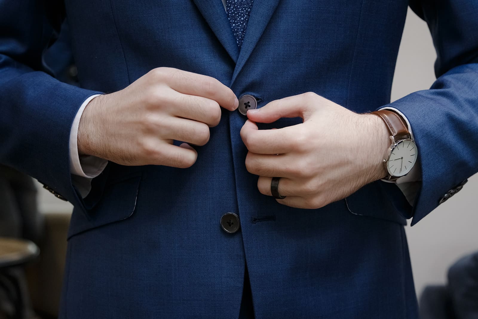 Buttoning the jacket