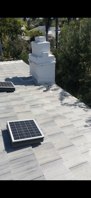 Completed flat tile roof with solar attic fan installation — AGK Construction South Florida