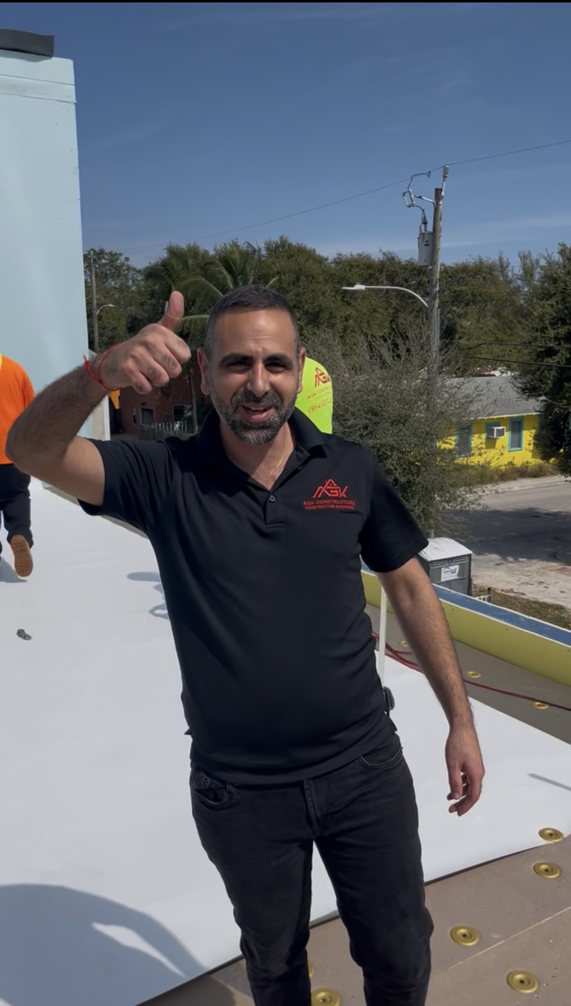 AGK Construction owner on completed TPO flat roof — South Florida