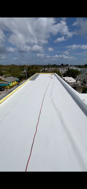 Completed TPO fleeceback flat roof — heat-welded seams — AGK Construction South Florida