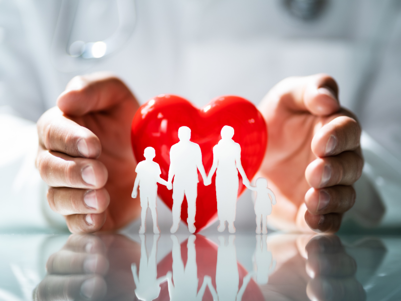 doctor sitting at the table in front of girl