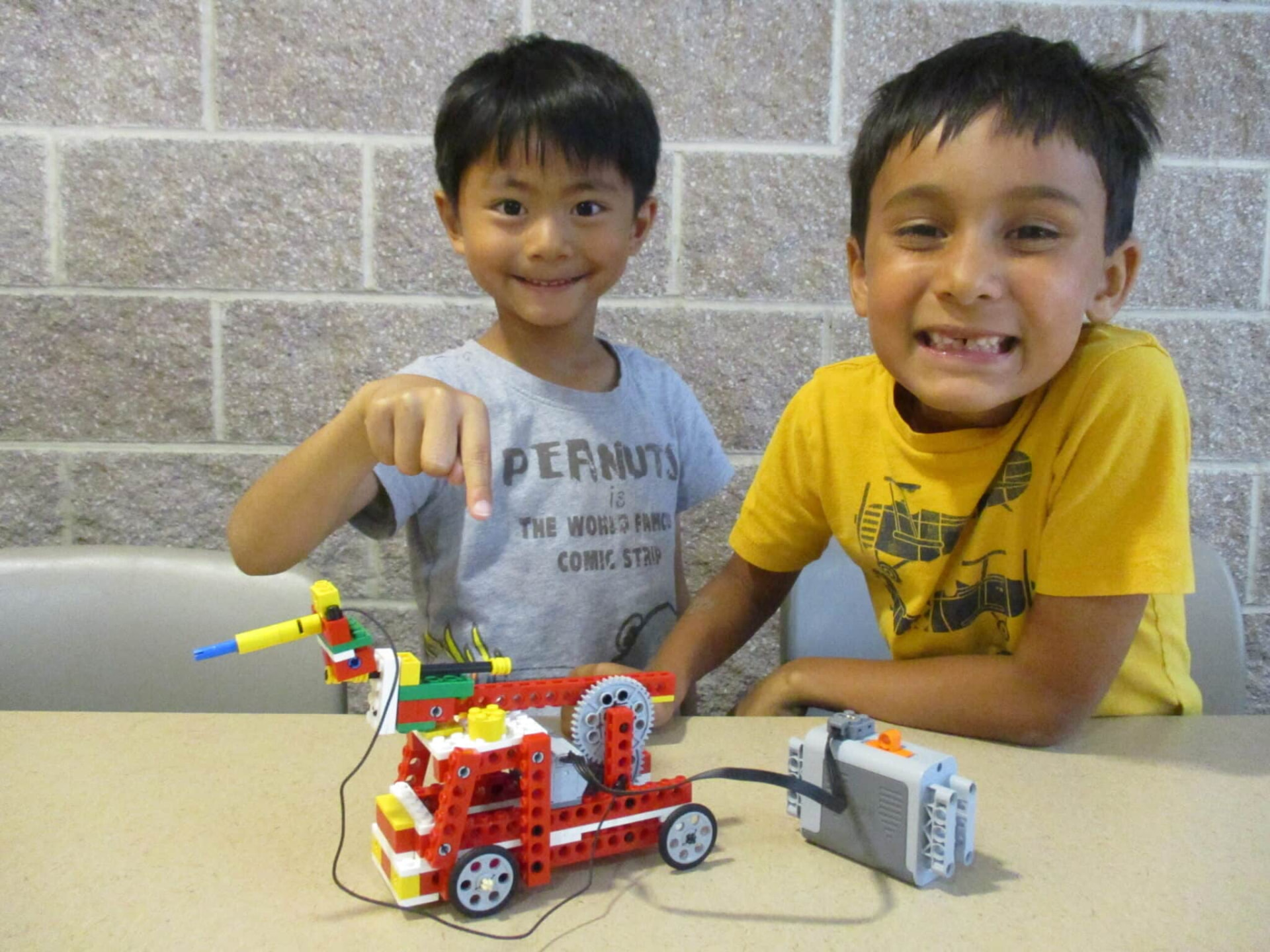 Two campers with their LEGO fire truck build at Holiday Camp