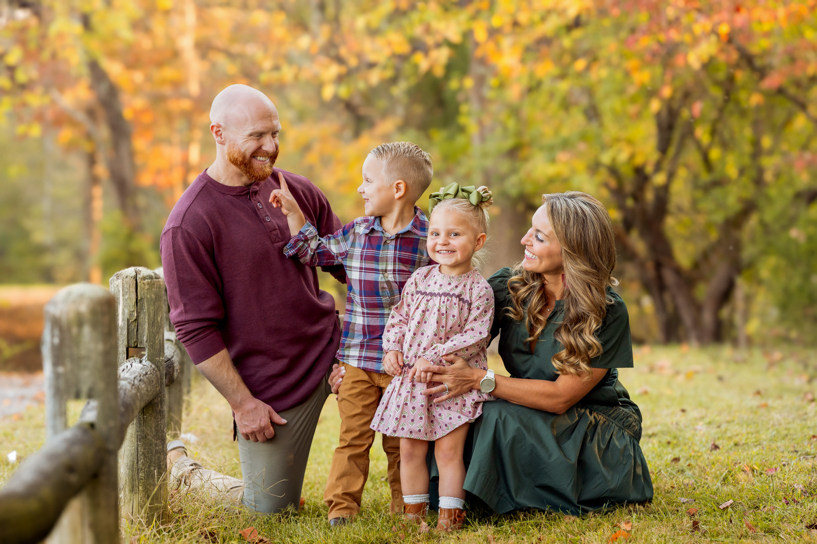 A father walks with his children during a fall family photography session.