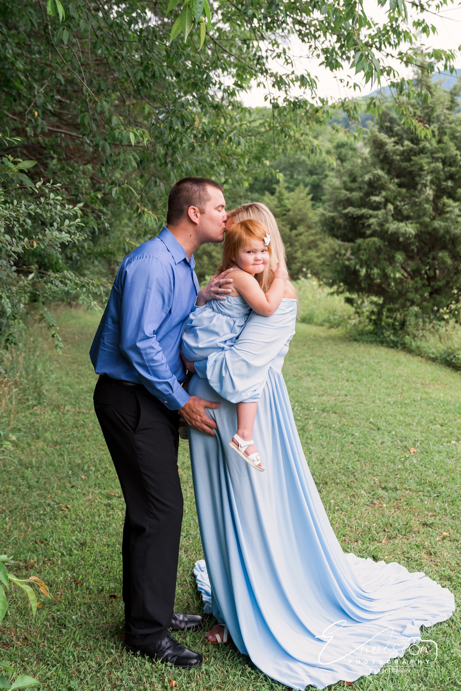 Partner and expectant mother together during a maternity portrait session