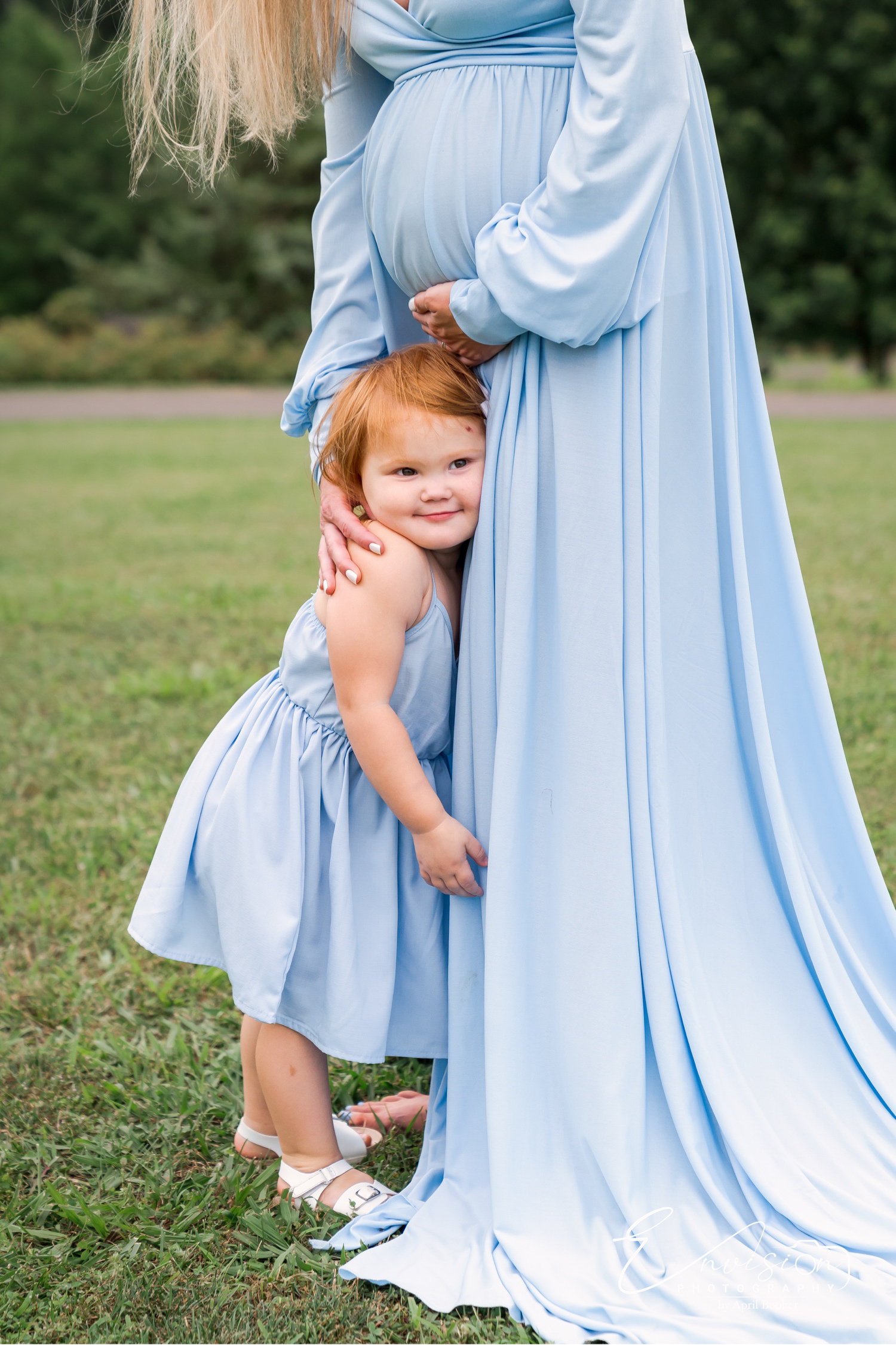 Playful family moment during outdoor maternity photos in Johnson City
