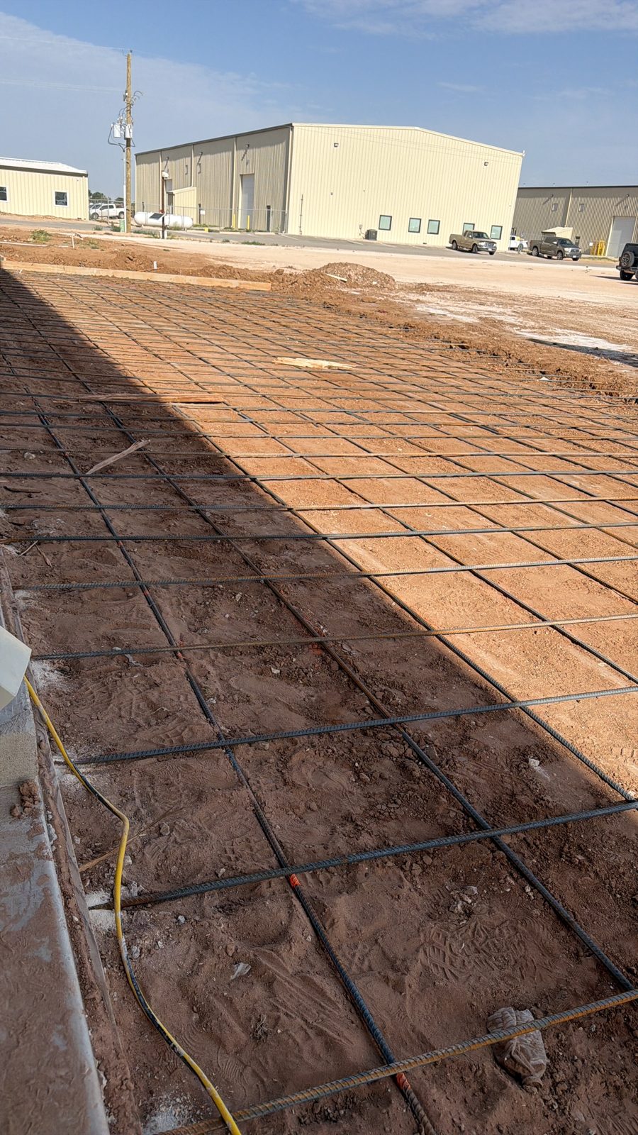 Concrete slab pour with steel rebar reinforcement by Andy's Concrete Finishing, Denton TX