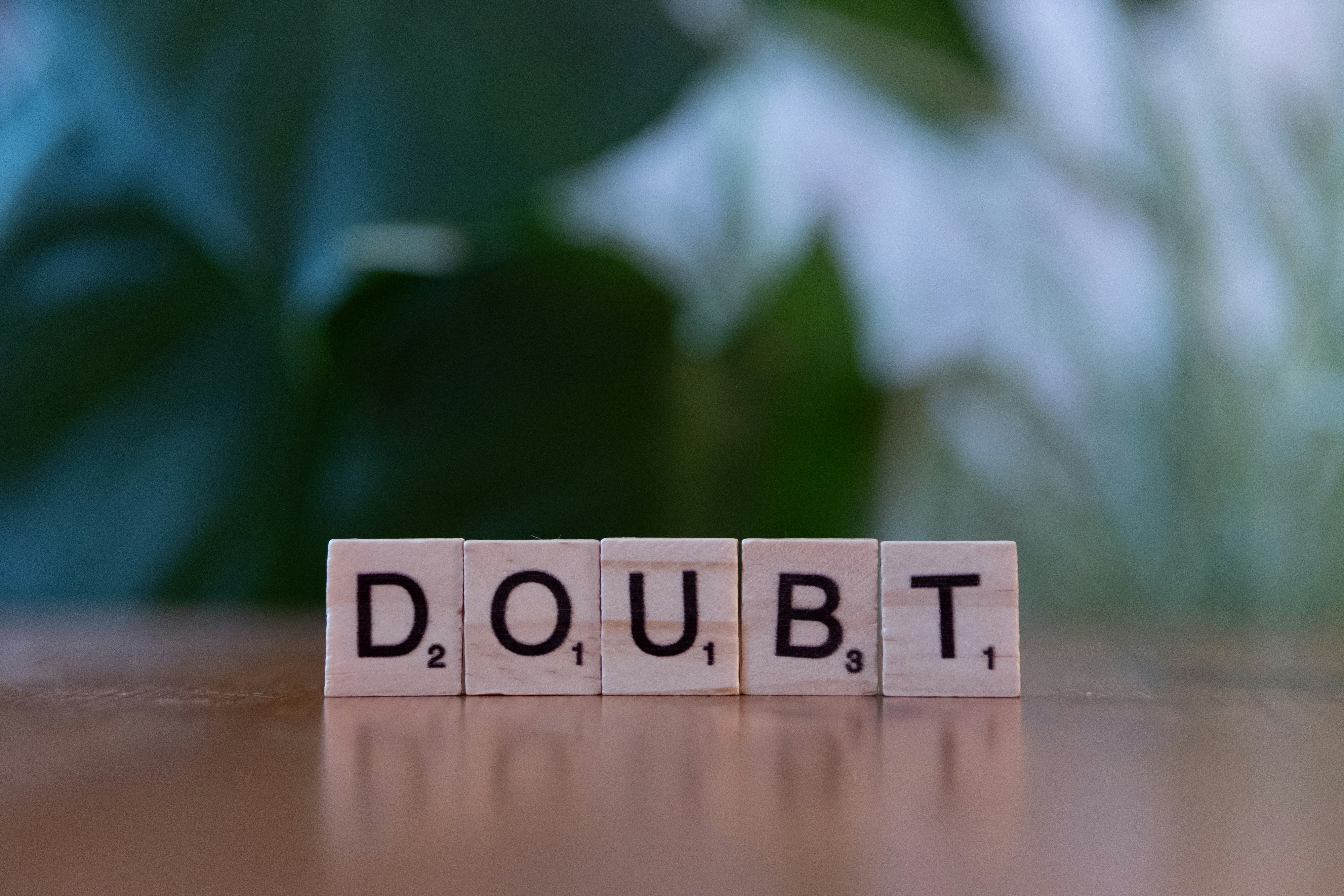 Tiles spelling 'Doubt' Tiles spelling 'Doubt'