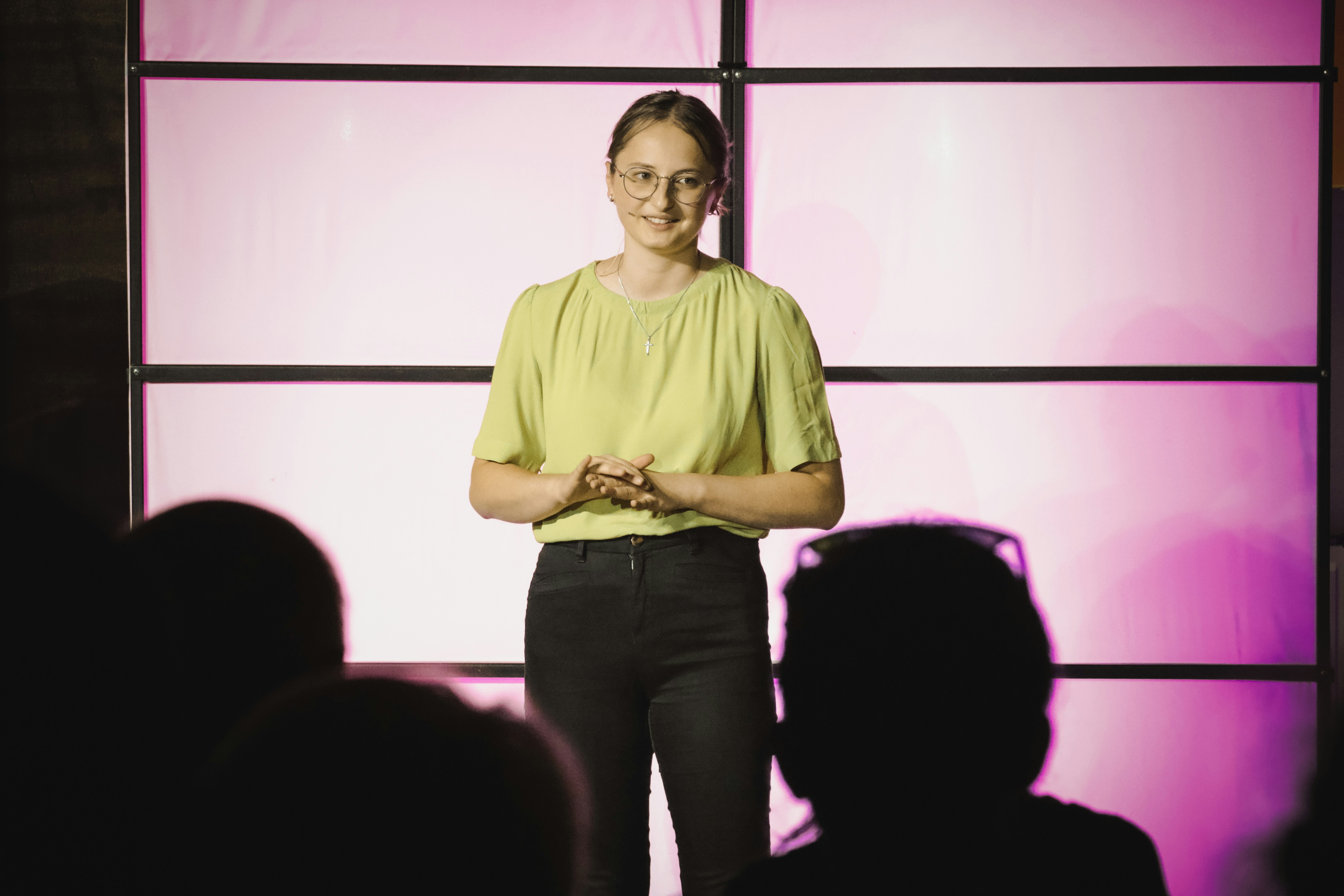 Woman speaking to a room full of people Woman speaking to a room full of people