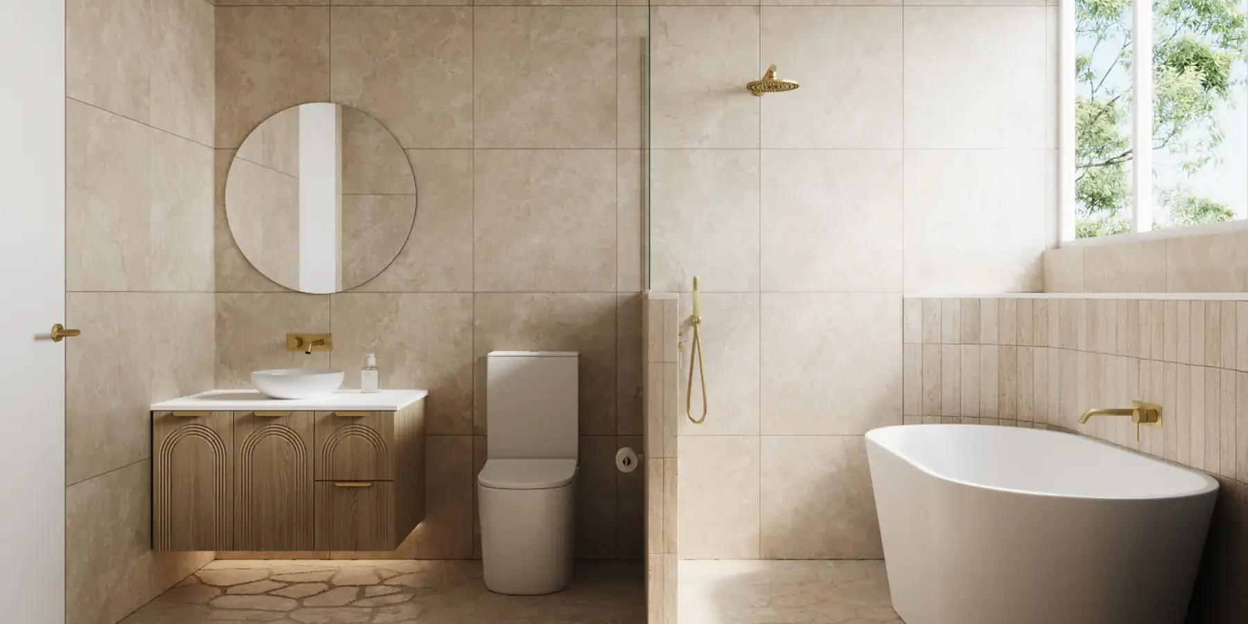 Travertine bathroom with freestanding bath and brass tapware