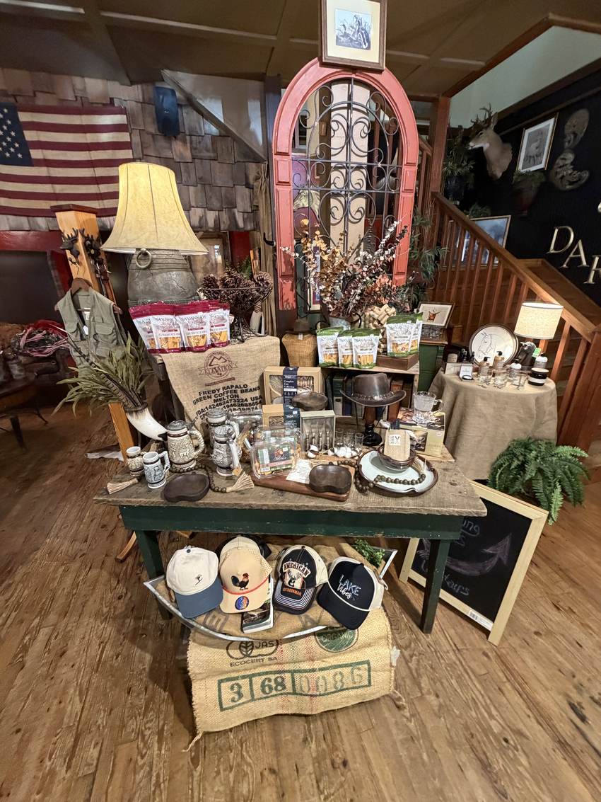 Packaged pantry goods, boards and glassware on the mercantile table at Horse Feathers Mercantile