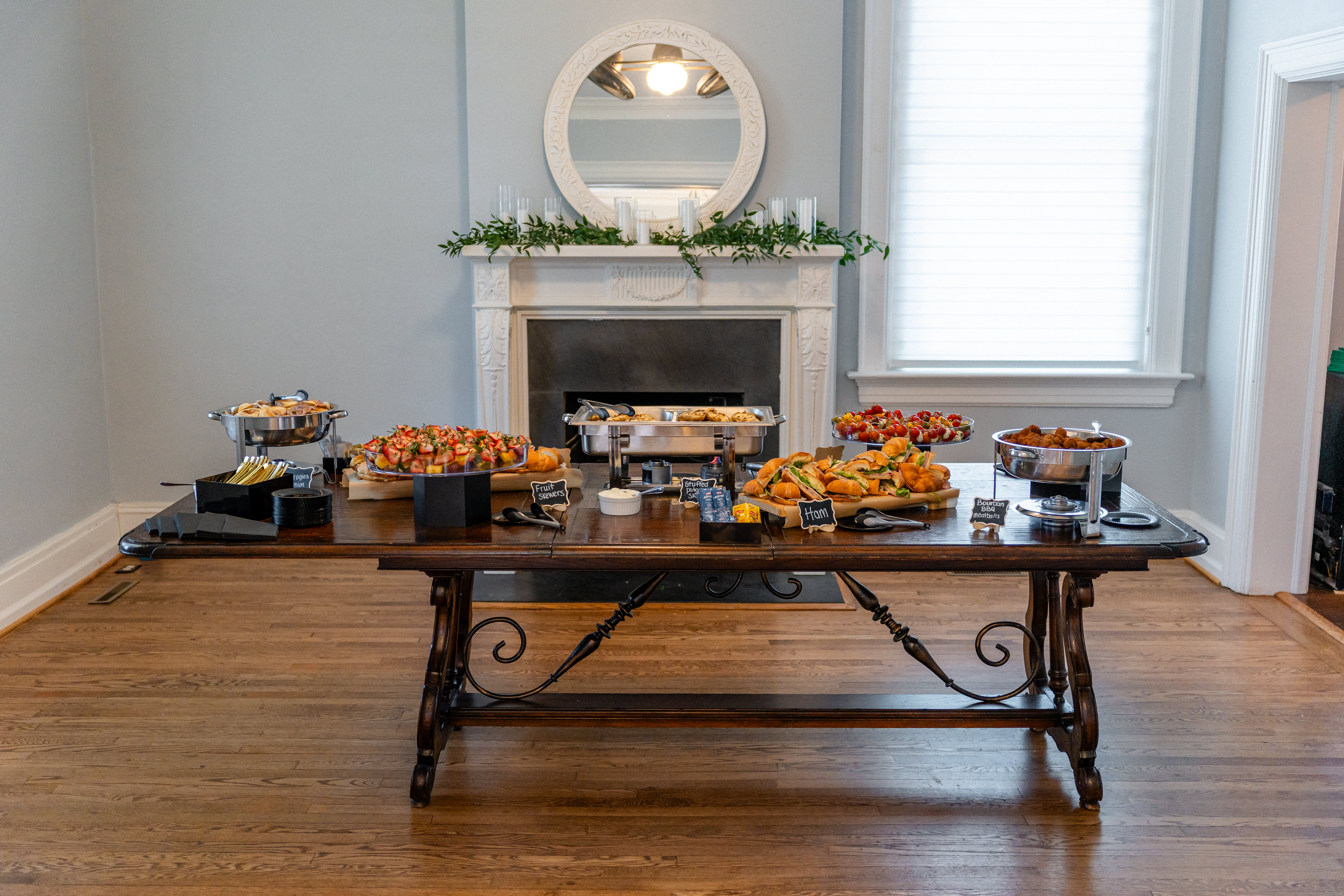 Buffet table set with appetizers and serving dishes inside a Bent Oaks Manor event room in Roanoke Virginia