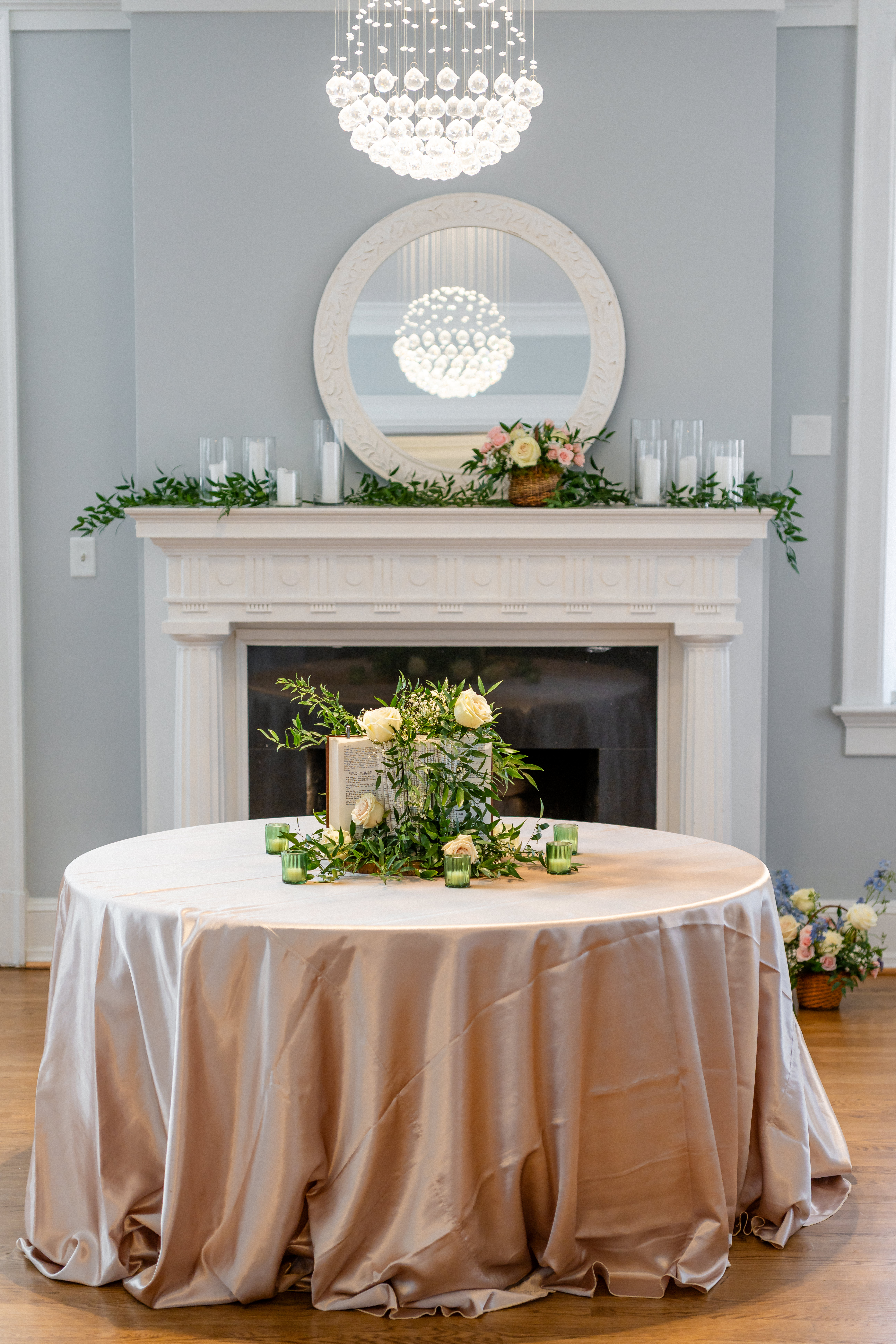 Decorated fireplace and dining table with a floral centerpiece inside Bent Oaks Manor in Roanoke Virginia