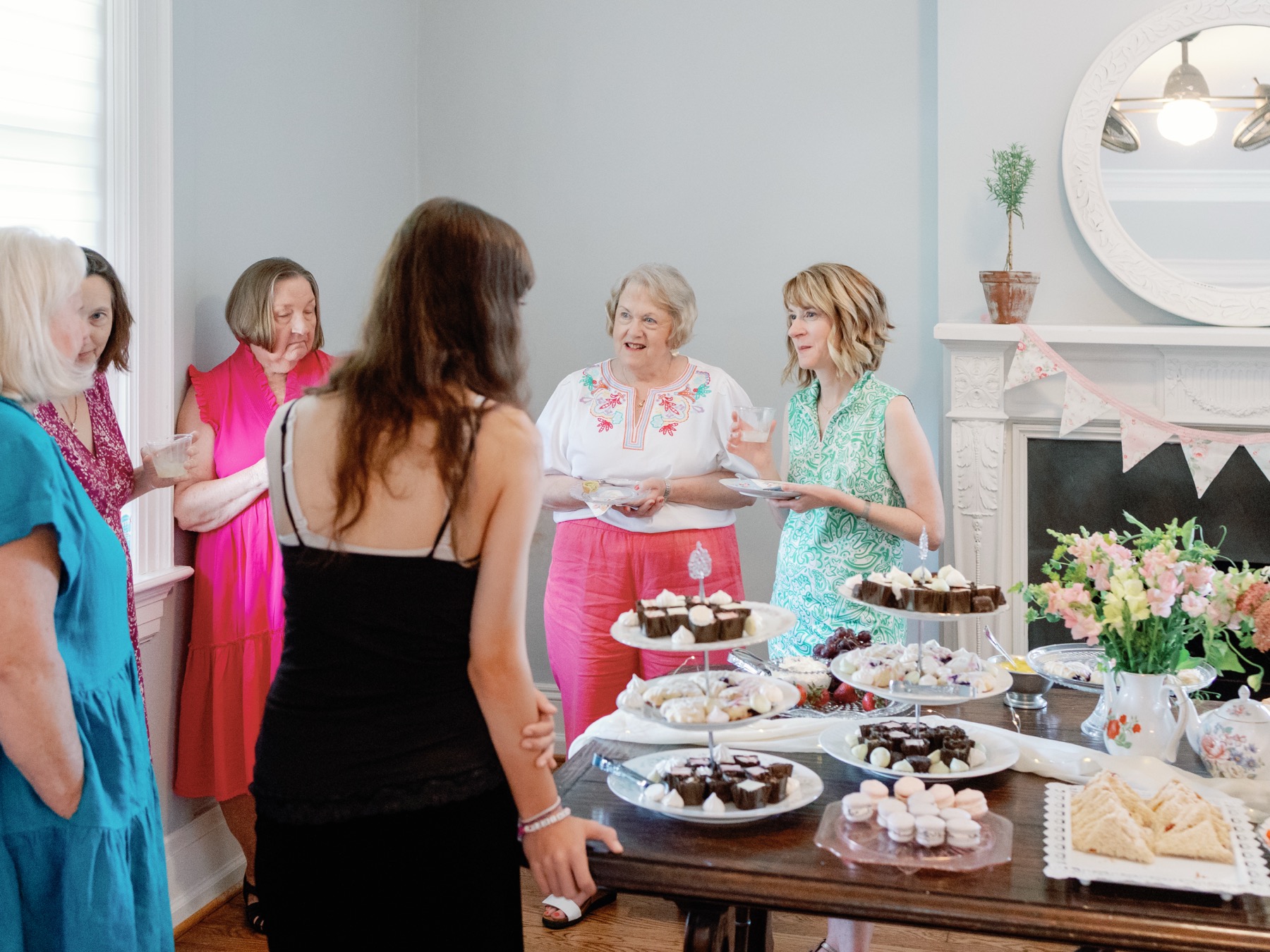 Guests gathering around a dessert and tea table during a private event at Bent Oaks Manor