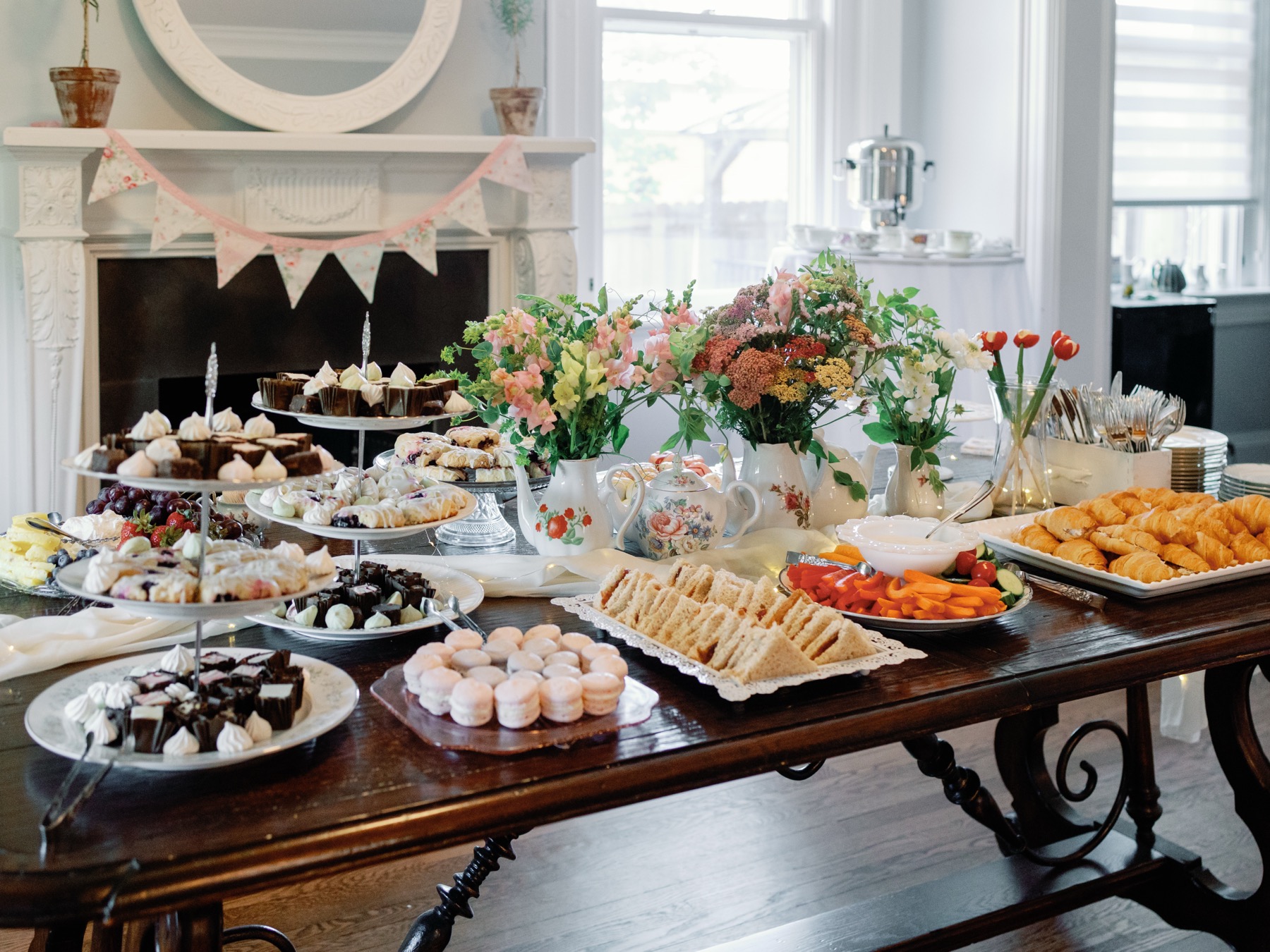 Elegant shower buffet with desserts, sandwiches, flowers, and tea service inside Bent Oaks Manor