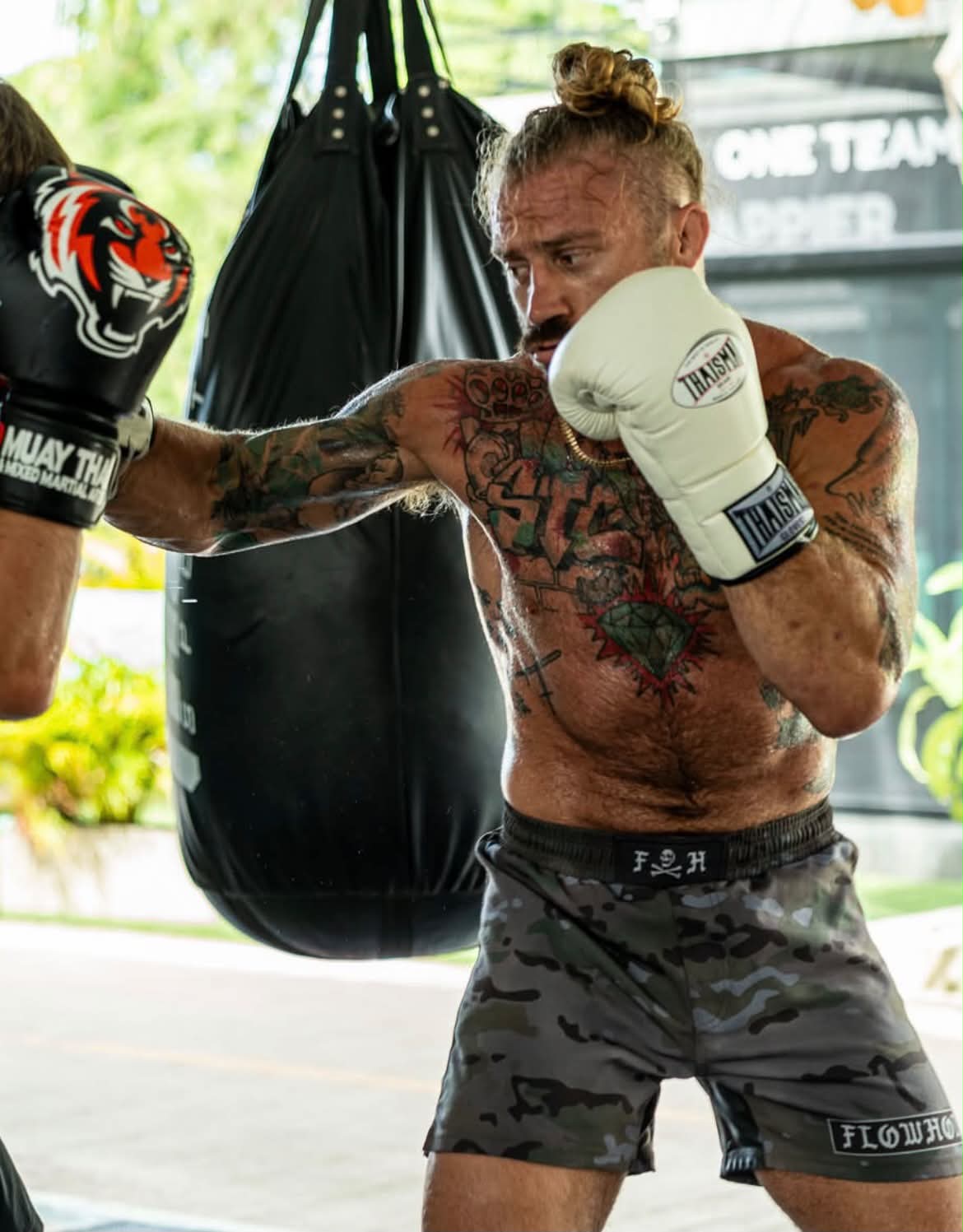 Coach Sloan working the heavy bag in Thailand