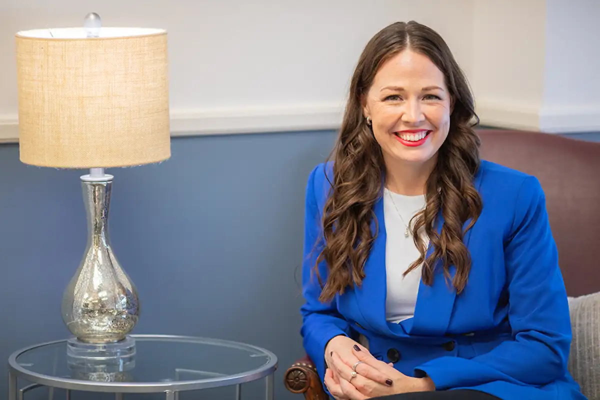 Smiling woman sitting in office chair