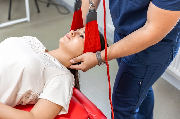Chiropractor treating a patient with neck injury due to car accident