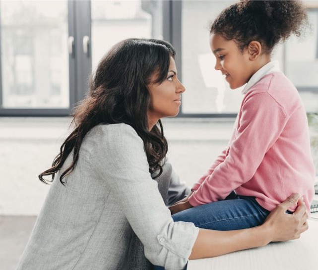 Parent and child reading together in a calm supportive moment