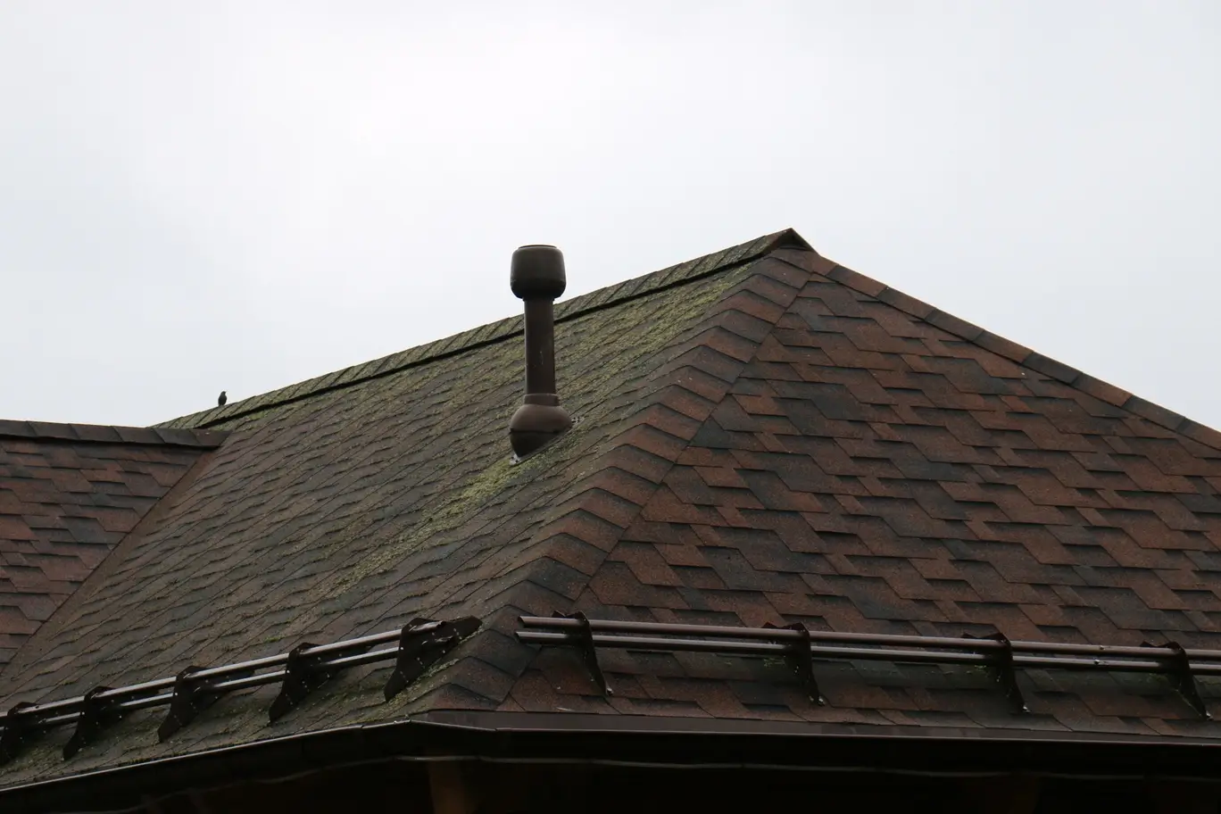 Crew installing new asphalt shingles during a roof replacement in Clarence-Rockland
