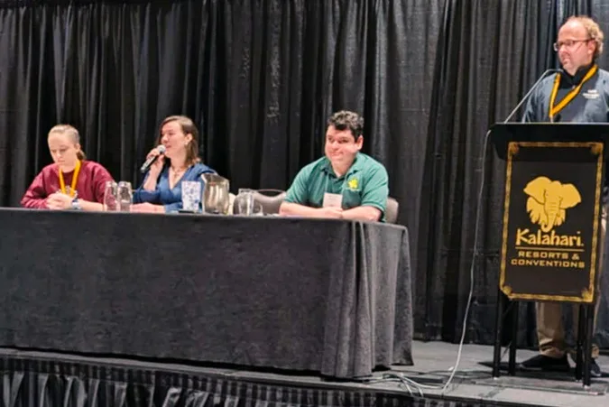Masha Pavlova speaking on a panel