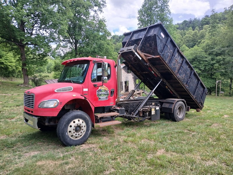 Roll-off truck on site