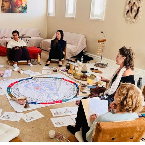 A circle seated around a Human Design chart