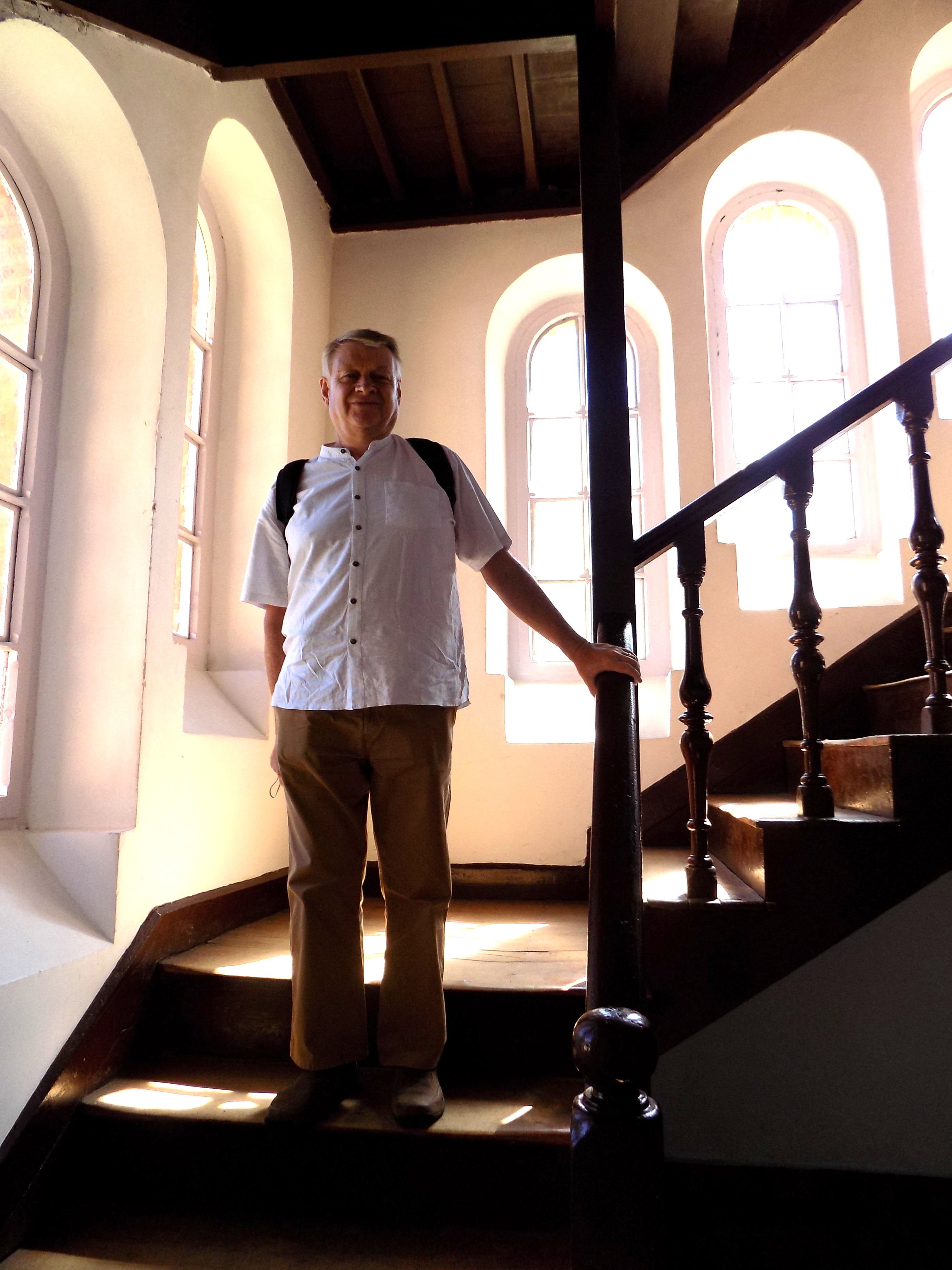 Mark standing on the stairs his Dad would have used every morning to go to assembly Mark standing on the stairs his Dad would have used every morning to go to assembly