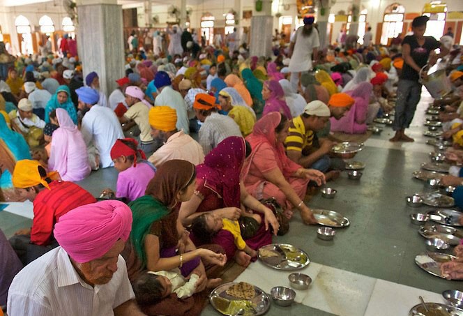 People eating in the langar People eating in the langar