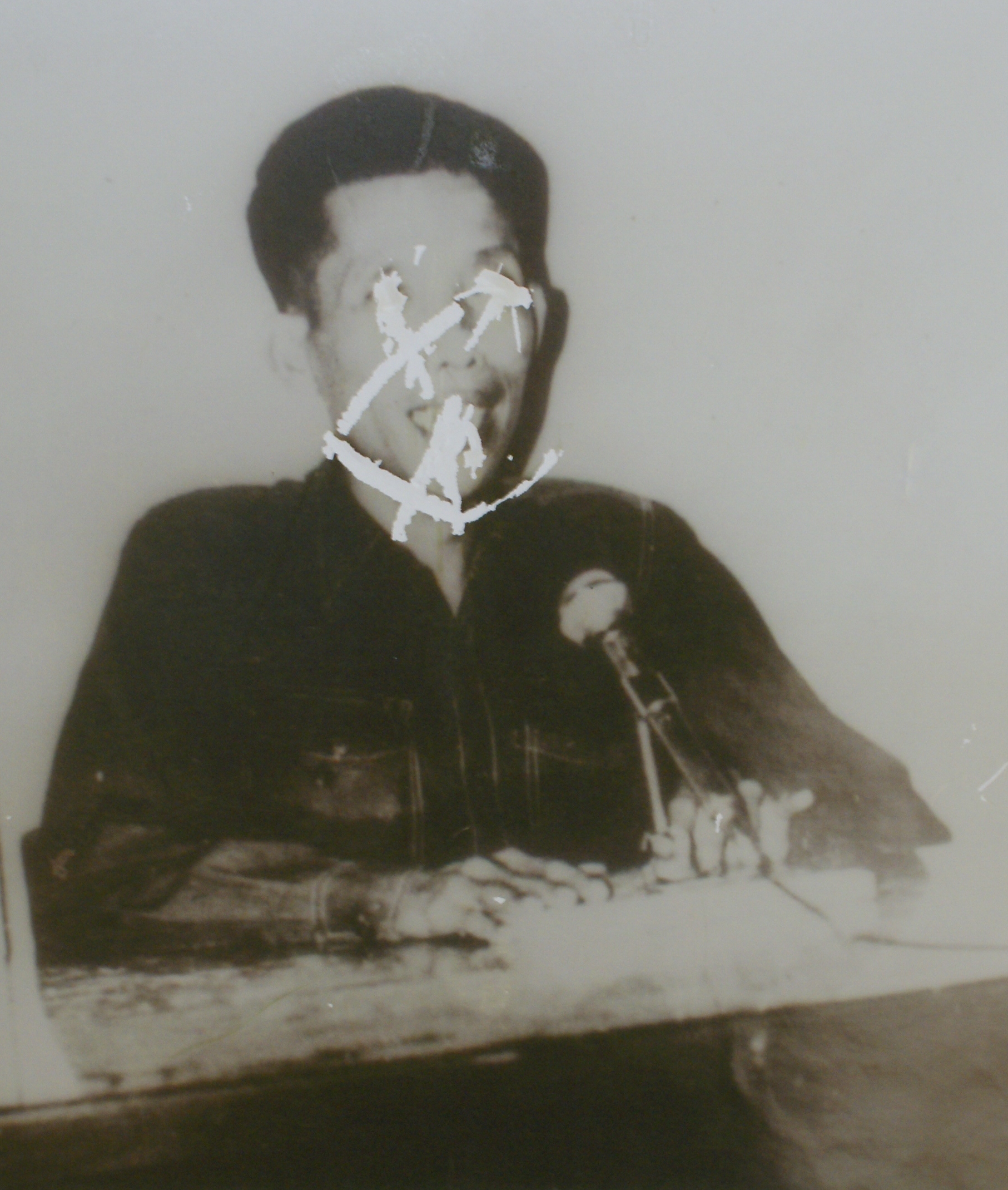 An image of a Khmer Rouge officer with his eyes scratched out An image of a Khmer Rouge officer with his eyes scratched out