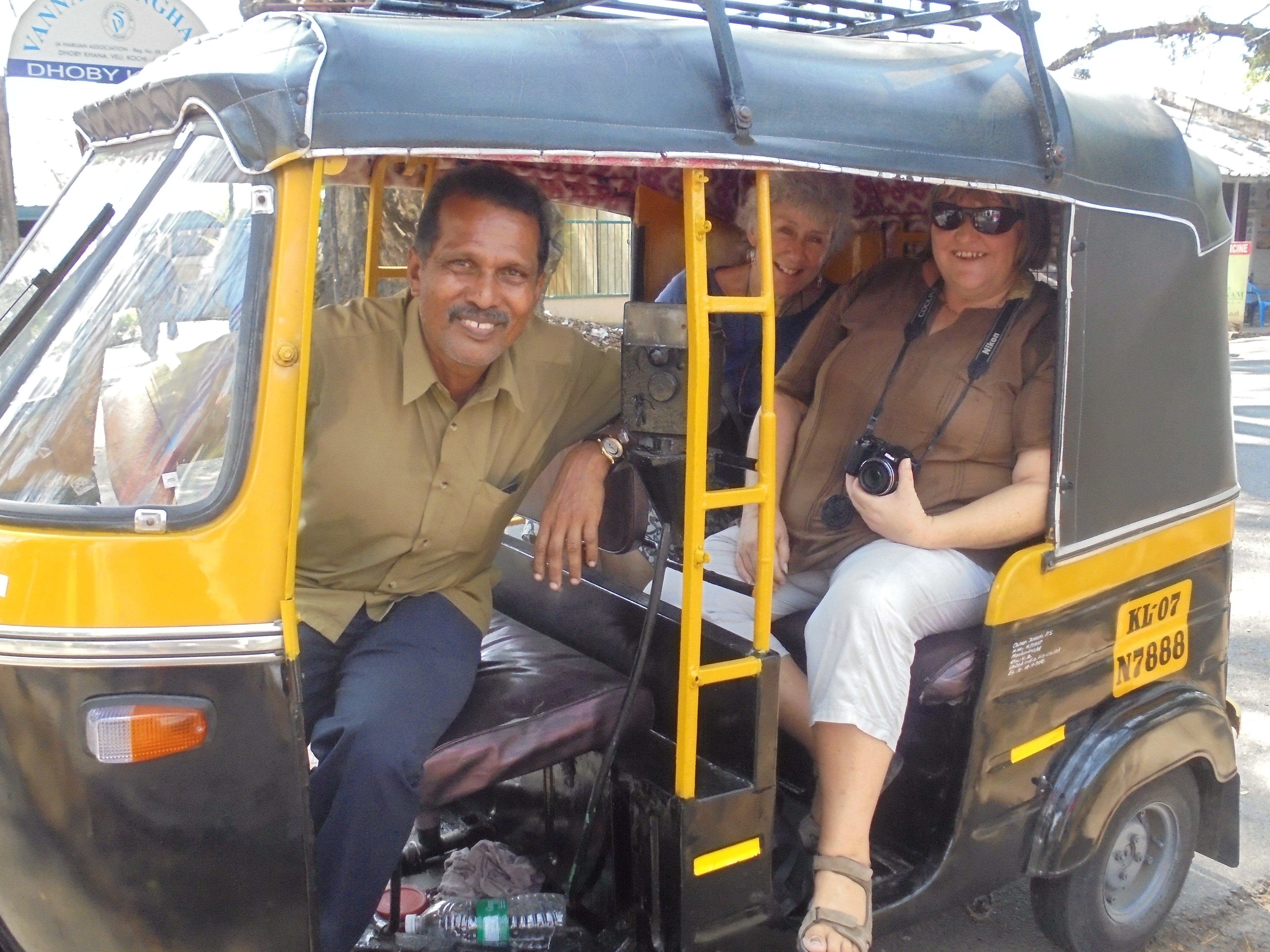 Joseph in his tuk-tuk with Jan and me in the back