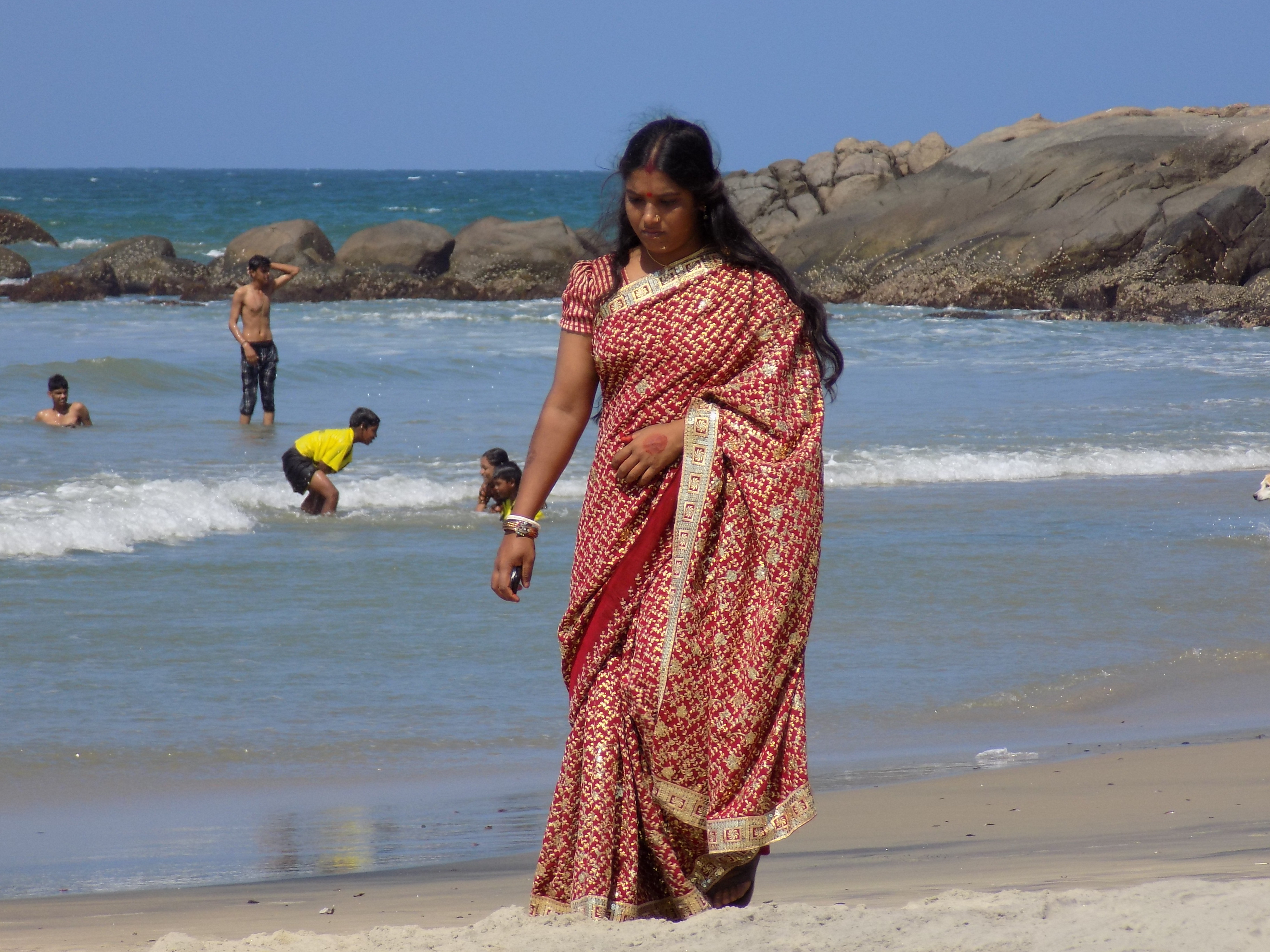Well dressed lady on Kovalam beach