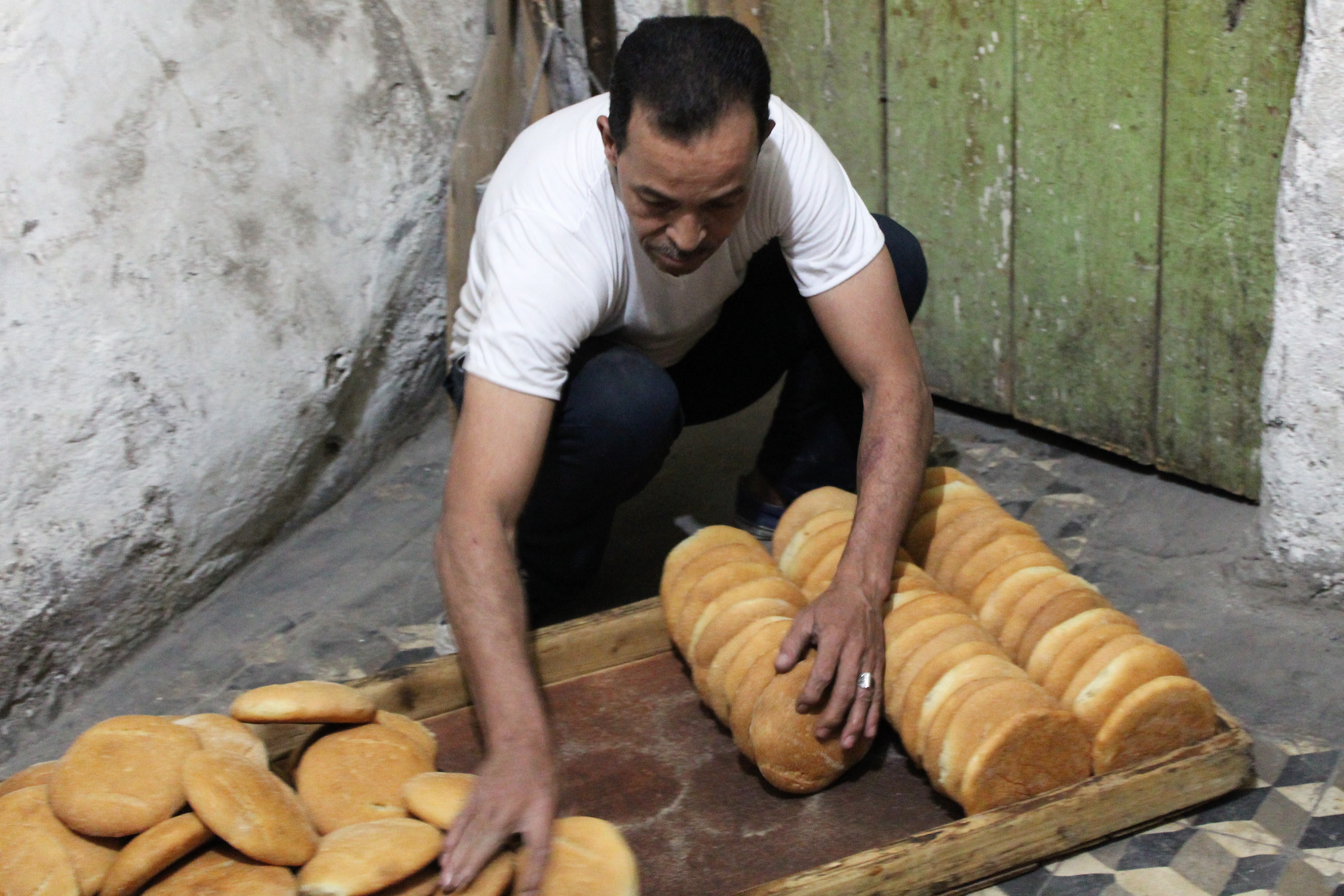 A baker packing khobz for the local food stalls in Marrakech