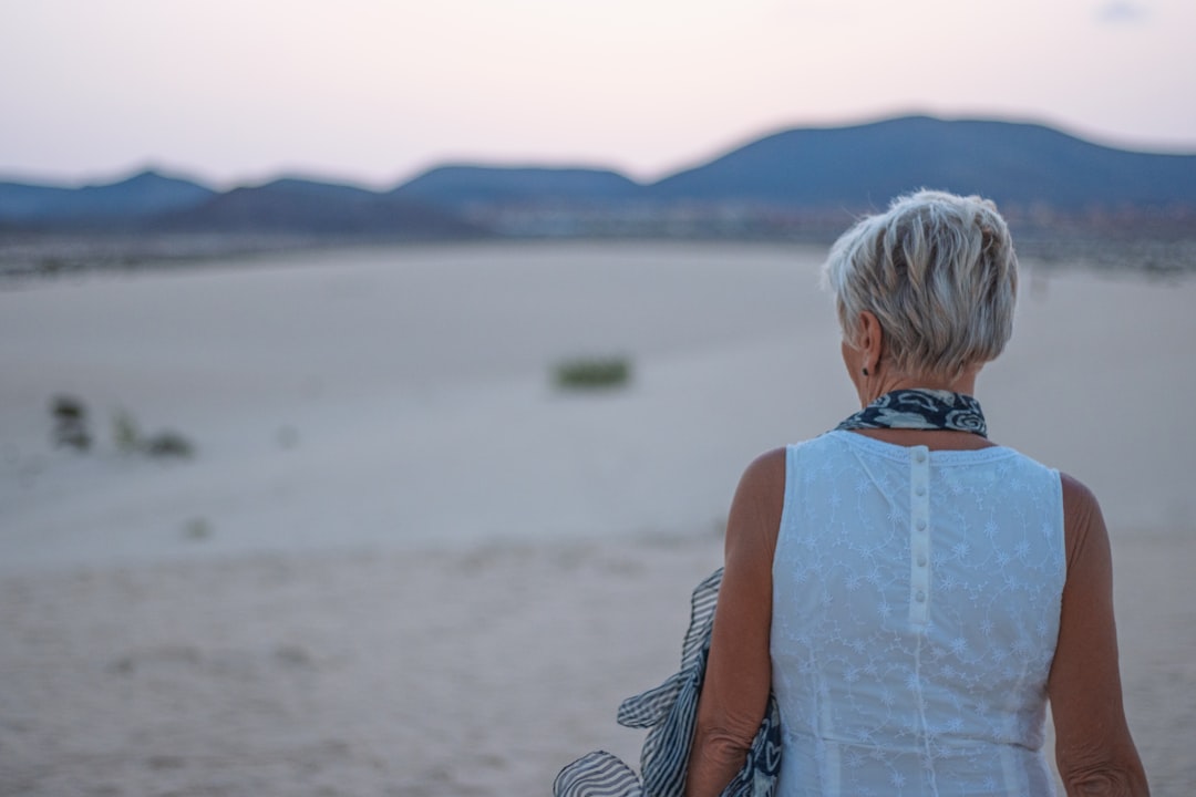 Mature woman looking out to sea