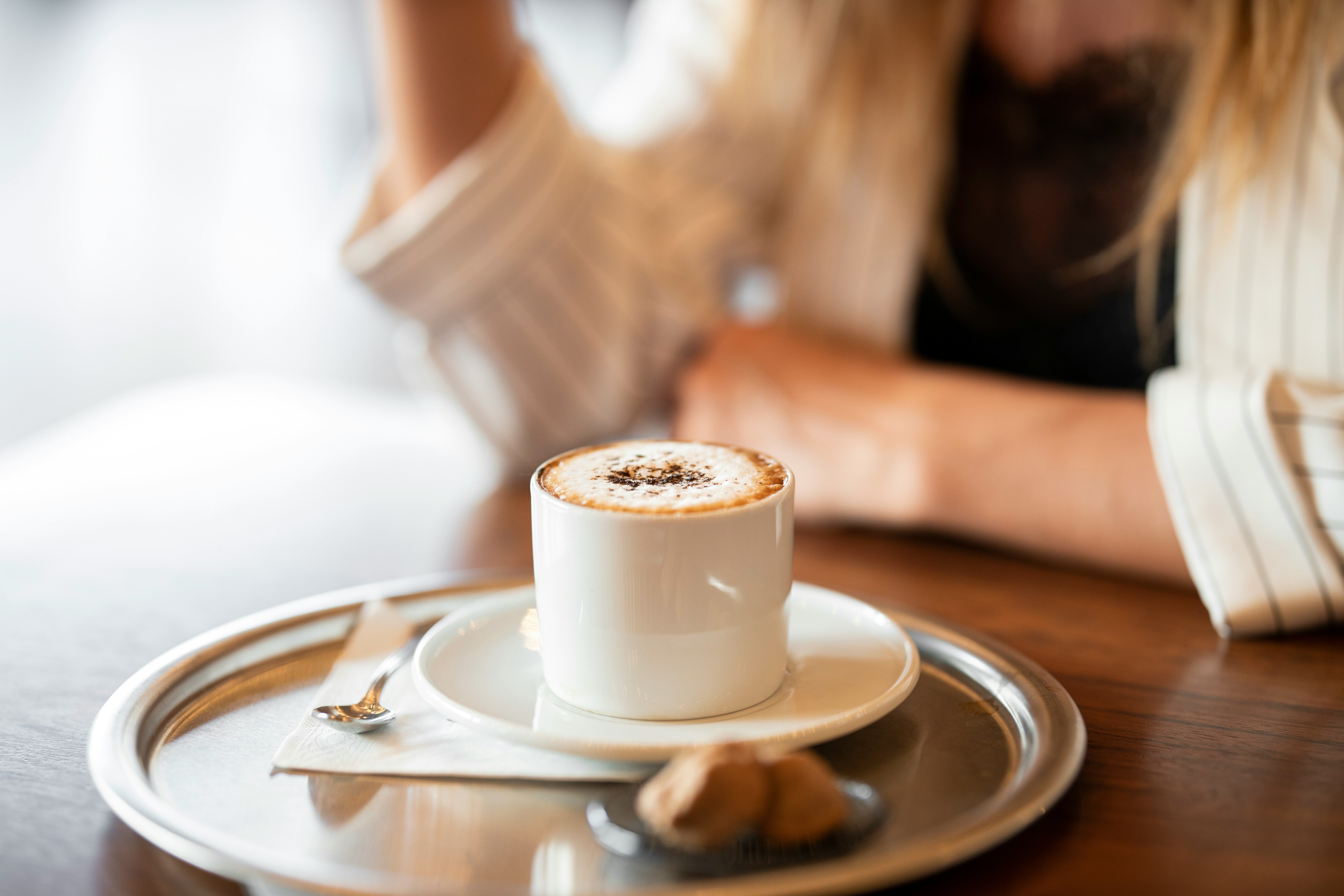 woman sitting in a cafe having a coffee